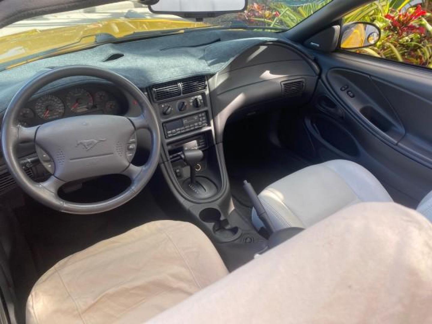 1999 Chrome Yellow /Oxford White Ford Mustang GT LOW MILES 8,145 1 OWNER FL CONV (1FAFP45X3XF) with an 4.6L SOHC SMPI V8 Engine engine, Automatic transmission, located at 4701 North Dixie Hwy, Pompano Beach, FL, 33064, (954) 422-2889, 26.240938, -80.123474 - OUR WEBPAGE FLORIDACARS1.COM HAS OVER 100 PHOTOS AND FREE CARFAX LINK 1999 FORD MUSTANG GT 1 OWNER VIN: 1FAFP45X3XF127745 1 F A F P 4 5 X 3 X F 1 2 7 7 4 5 CONVERTIBLE 4.6L V8 F SOHC 16V GASOLINE 24 MPG REAR WHEEL DRIVE Features ABS Brakes Air Conditioning Alloy Wheels AM/FM Stereo Automatic Transmi - Photo#51