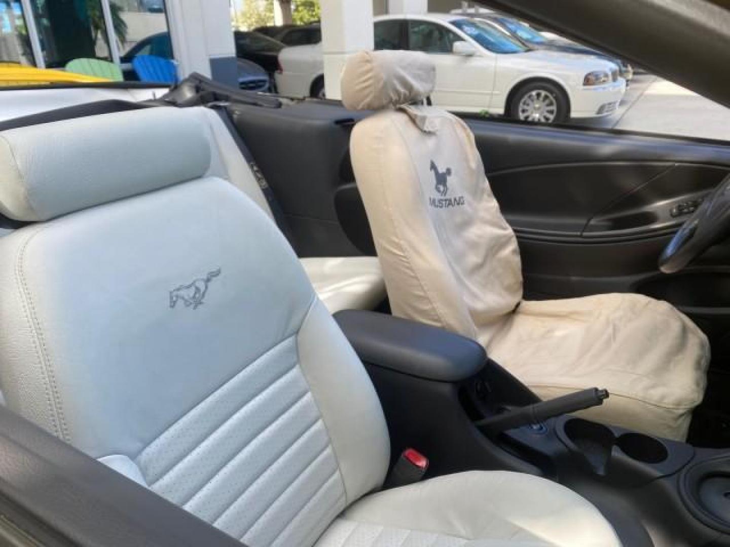 1999 Chrome Yellow /Oxford White Ford Mustang GT LOW MILES 8,145 1 OWNER FL CONV (1FAFP45X3XF) with an 4.6L SOHC SMPI V8 Engine engine, Automatic transmission, located at 4701 North Dixie Hwy, Pompano Beach, FL, 33064, (954) 422-2889, 26.240938, -80.123474 - OUR WEBPAGE FLORIDACARS1.COM HAS OVER 100 PHOTOS AND FREE CARFAX LINK 1999 FORD MUSTANG GT 1 OWNER VIN: 1FAFP45X3XF127745 1 F A F P 4 5 X 3 X F 1 2 7 7 4 5 CONVERTIBLE 4.6L V8 F SOHC 16V GASOLINE 24 MPG REAR WHEEL DRIVE Features ABS Brakes Air Conditioning Alloy Wheels AM/FM Stereo Automatic Transmi - Photo#52
