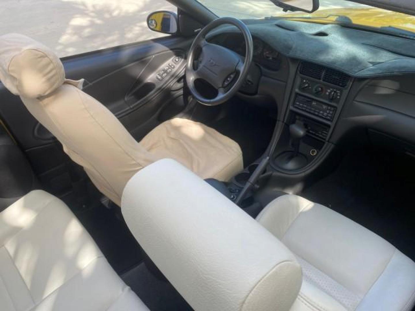 1999 Chrome Yellow /Oxford White Ford Mustang GT LOW MILES 8,145 1 OWNER FL CONV (1FAFP45X3XF) with an 4.6L SOHC SMPI V8 Engine engine, Automatic transmission, located at 4701 North Dixie Hwy, Pompano Beach, FL, 33064, (954) 422-2889, 26.240938, -80.123474 - OUR WEBPAGE FLORIDACARS1.COM HAS OVER 100 PHOTOS AND FREE CARFAX LINK 1999 FORD MUSTANG GT 1 OWNER VIN: 1FAFP45X3XF127745 1 F A F P 4 5 X 3 X F 1 2 7 7 4 5 CONVERTIBLE 4.6L V8 F SOHC 16V GASOLINE 24 MPG REAR WHEEL DRIVE Features ABS Brakes Air Conditioning Alloy Wheels AM/FM Stereo Automatic Transmi - Photo#54