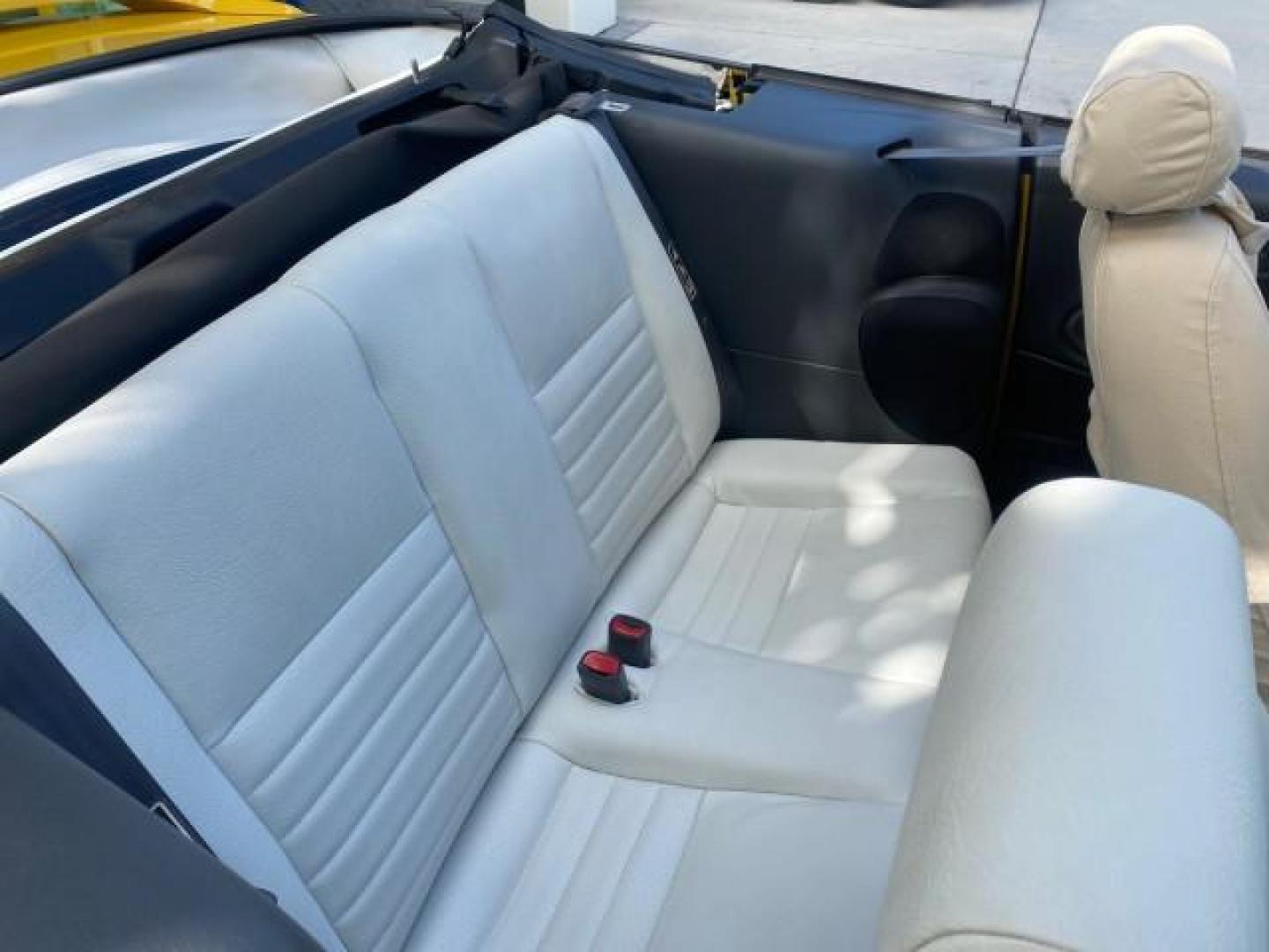 1999 Chrome Yellow /Oxford White Ford Mustang GT LOW MILES 8,145 1 OWNER FL CONV (1FAFP45X3XF) with an 4.6L SOHC SMPI V8 Engine engine, Automatic transmission, located at 4701 North Dixie Hwy, Pompano Beach, FL, 33064, (954) 422-2889, 26.240938, -80.123474 - OUR WEBPAGE FLORIDACARS1.COM HAS OVER 100 PHOTOS AND FREE CARFAX LINK 1999 FORD MUSTANG GT 1 OWNER VIN: 1FAFP45X3XF127745 1 F A F P 4 5 X 3 X F 1 2 7 7 4 5 CONVERTIBLE 4.6L V8 F SOHC 16V GASOLINE 24 MPG REAR WHEEL DRIVE Features ABS Brakes Air Conditioning Alloy Wheels AM/FM Stereo Automatic Transmi - Photo#55