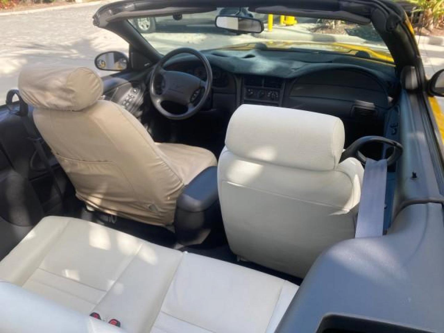 1999 Chrome Yellow /Oxford White Ford Mustang GT LOW MILES 8,145 1 OWNER FL CONV (1FAFP45X3XF) with an 4.6L SOHC SMPI V8 Engine engine, Automatic transmission, located at 4701 North Dixie Hwy, Pompano Beach, FL, 33064, (954) 422-2889, 26.240938, -80.123474 - OUR WEBPAGE FLORIDACARS1.COM HAS OVER 100 PHOTOS AND FREE CARFAX LINK 1999 FORD MUSTANG GT 1 OWNER VIN: 1FAFP45X3XF127745 1 F A F P 4 5 X 3 X F 1 2 7 7 4 5 CONVERTIBLE 4.6L V8 F SOHC 16V GASOLINE 24 MPG REAR WHEEL DRIVE Features ABS Brakes Air Conditioning Alloy Wheels AM/FM Stereo Automatic Transmi - Photo#56