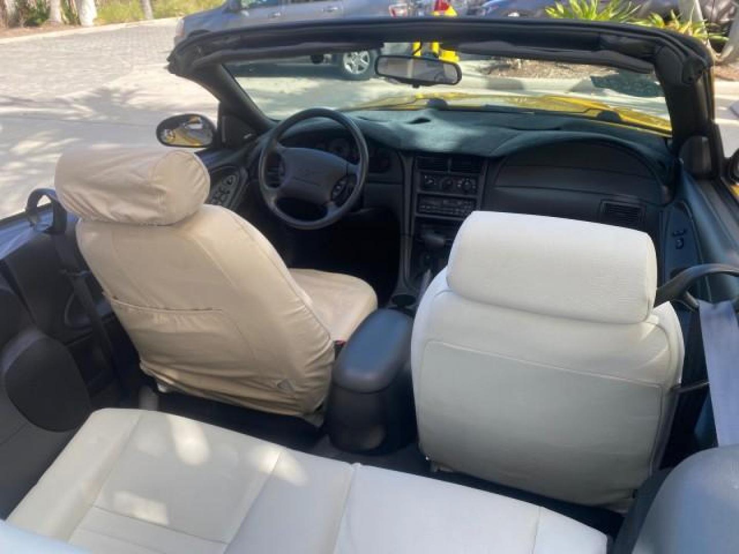 1999 Chrome Yellow /Oxford White Ford Mustang GT LOW MILES 8,145 1 OWNER FL CONV (1FAFP45X3XF) with an 4.6L SOHC SMPI V8 Engine engine, Automatic transmission, located at 4701 North Dixie Hwy, Pompano Beach, FL, 33064, (954) 422-2889, 26.240938, -80.123474 - OUR WEBPAGE FLORIDACARS1.COM HAS OVER 100 PHOTOS AND FREE CARFAX LINK 1999 FORD MUSTANG GT 1 OWNER VIN: 1FAFP45X3XF127745 1 F A F P 4 5 X 3 X F 1 2 7 7 4 5 CONVERTIBLE 4.6L V8 F SOHC 16V GASOLINE 24 MPG REAR WHEEL DRIVE Features ABS Brakes Air Conditioning Alloy Wheels AM/FM Stereo Automatic Transmi - Photo#57