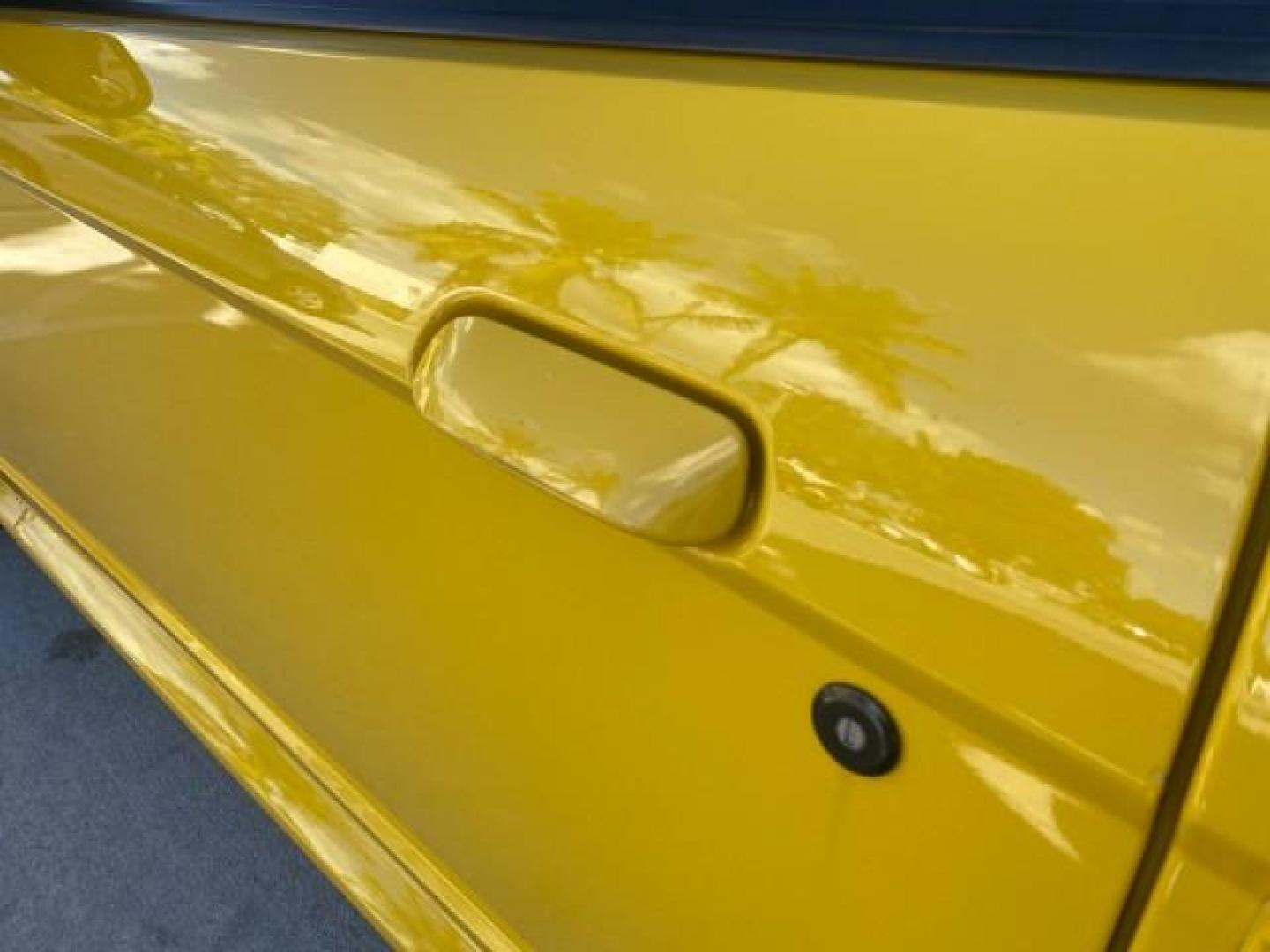 1999 Chrome Yellow /Oxford White Ford Mustang GT LOW MILES 8,145 1 OWNER FL CONV (1FAFP45X3XF) with an 4.6L SOHC SMPI V8 Engine engine, Automatic transmission, located at 4701 North Dixie Hwy, Pompano Beach, FL, 33064, (954) 422-2889, 26.240938, -80.123474 - OUR WEBPAGE FLORIDACARS1.COM HAS OVER 100 PHOTOS AND FREE CARFAX LINK 1999 FORD MUSTANG GT 1 OWNER VIN: 1FAFP45X3XF127745 1 F A F P 4 5 X 3 X F 1 2 7 7 4 5 CONVERTIBLE 4.6L V8 F SOHC 16V GASOLINE 24 MPG REAR WHEEL DRIVE Features ABS Brakes Air Conditioning Alloy Wheels AM/FM Stereo Automatic Transmi - Photo#66