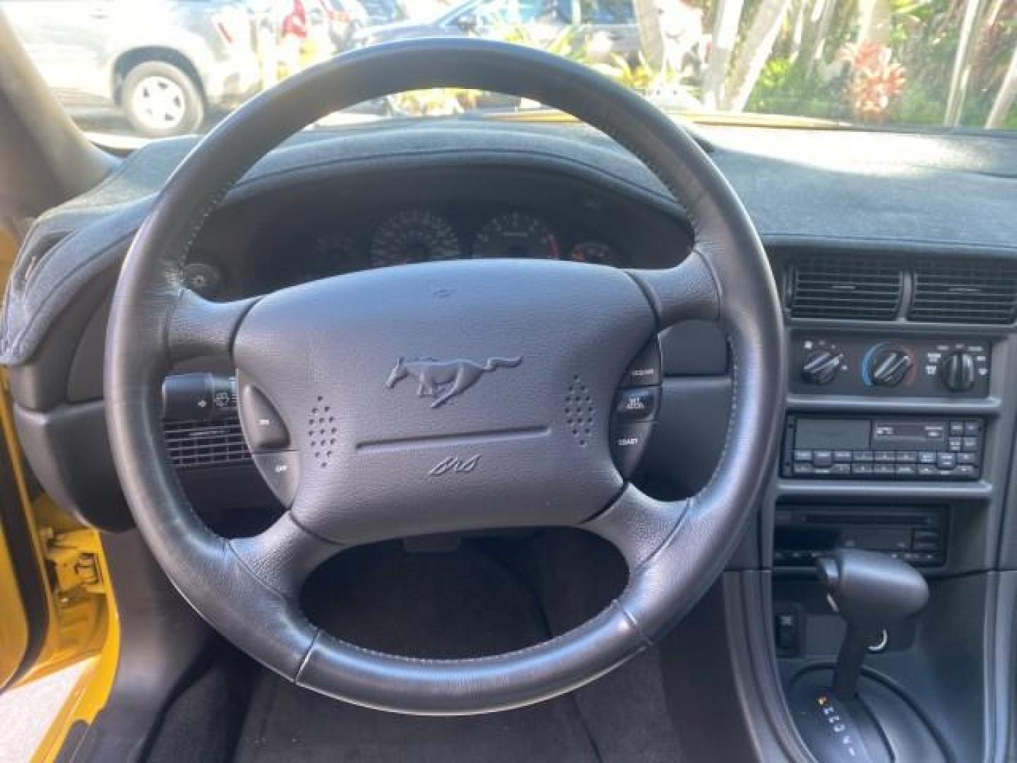 1999 Chrome Yellow /Oxford White Ford Mustang GT LOW MILES 8,145 1 OWNER FL CONV (1FAFP45X3XF) with an 4.6L SOHC SMPI V8 Engine engine, Automatic transmission, located at 4701 North Dixie Hwy, Pompano Beach, FL, 33064, (954) 422-2889, 26.240938, -80.123474 - OUR WEBPAGE FLORIDACARS1.COM HAS OVER 100 PHOTOS AND FREE CARFAX LINK 1999 FORD MUSTANG GT 1 OWNER VIN: 1FAFP45X3XF127745 1 F A F P 4 5 X 3 X F 1 2 7 7 4 5 CONVERTIBLE 4.6L V8 F SOHC 16V GASOLINE 24 MPG REAR WHEEL DRIVE Features ABS Brakes Air Conditioning Alloy Wheels AM/FM Stereo Automatic Transmi - Photo#76
