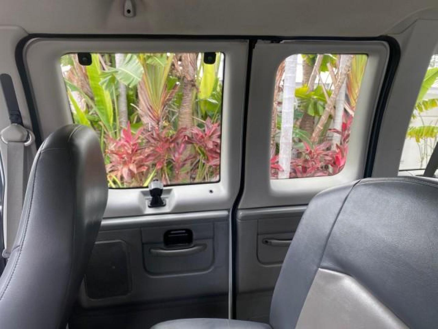 2008 Oxford White /Medium Flint Ford Econoline Wagon XLT 15 PASSENGERS E350 CLEAN (1FBSS31L78D) with an 5.4L EFI V8 Engine engine, Automatic transmission, located at 4701 North Dixie Hwy, Pompano Beach, FL, 33064, (954) 422-2889, 26.240938, -80.123474 - OUR WEBPAGE FLORIDACARS1.COM HAS OVER 100 PHOTOS AND FREE CARFAX LINK 2008 FORD E-SERIES E-350 SD XLT 15 PASSENGER VIN: 1FBSS31L78DA45023 1 F B S S 3 1 L 7 8 D A 4 5 0 2 3 VAN 5.4L V8 F SOHC 16V GASOLINE REAR WHEEL DRIVE Features ABS Brakes Air Conditioning AM/FM Stereo Automatic Transmission Barn D- Photo#76