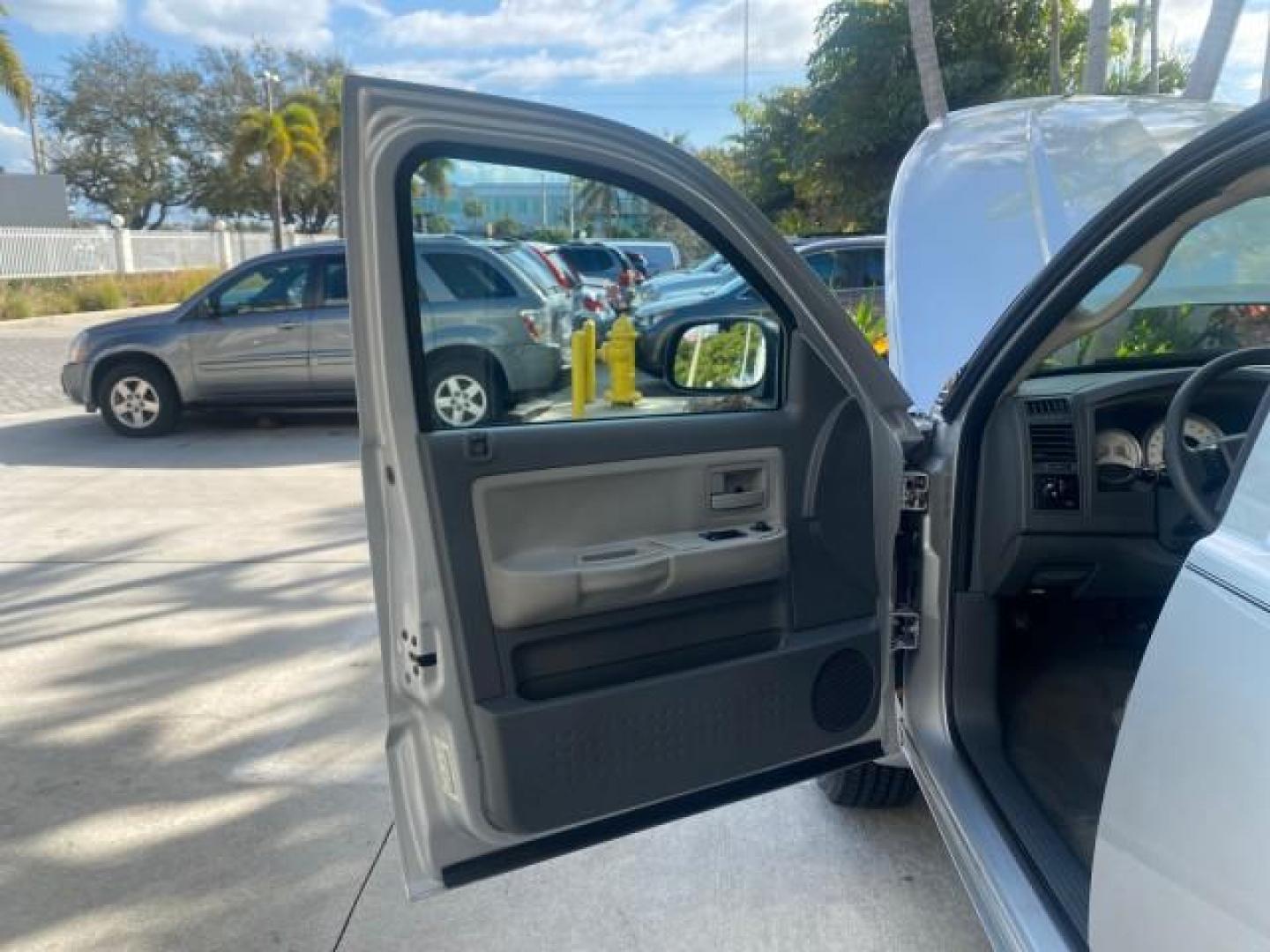 2006 Bright Silver Metallic /Med Slate Gray Dodge Dakota SLT CLUB CAB LOW MILES 55,990 (1D7HE42K06S) with an 3.7L V6 Magnum Engine engine, Automatic transmission, located at 4701 North Dixie Hwy, Pompano Beach, FL, 33064, (954) 422-2889, 26.240938, -80.123474 - OUR WEBPAGE FLORIDACARS1.COM HAS OVER 100 PHOTOS AND FREE CARFAX LINK 2006 DODGE DAKOTA SLT 1 OWNER CLUB CAB 4 DOOR ALL DOORS OPEN VIN: 1D7HE42K06S506201 1 D 7 H E 4 2 K 0 6 S 5 0 6 2 0 1 CLUB CAB PICKUP 3.7L V6 F OHV GASOLINE 22 MPG REAR WHEEL DRIVE Features ABS Brakes Air Conditioning Alloy Wheels- Photo#9