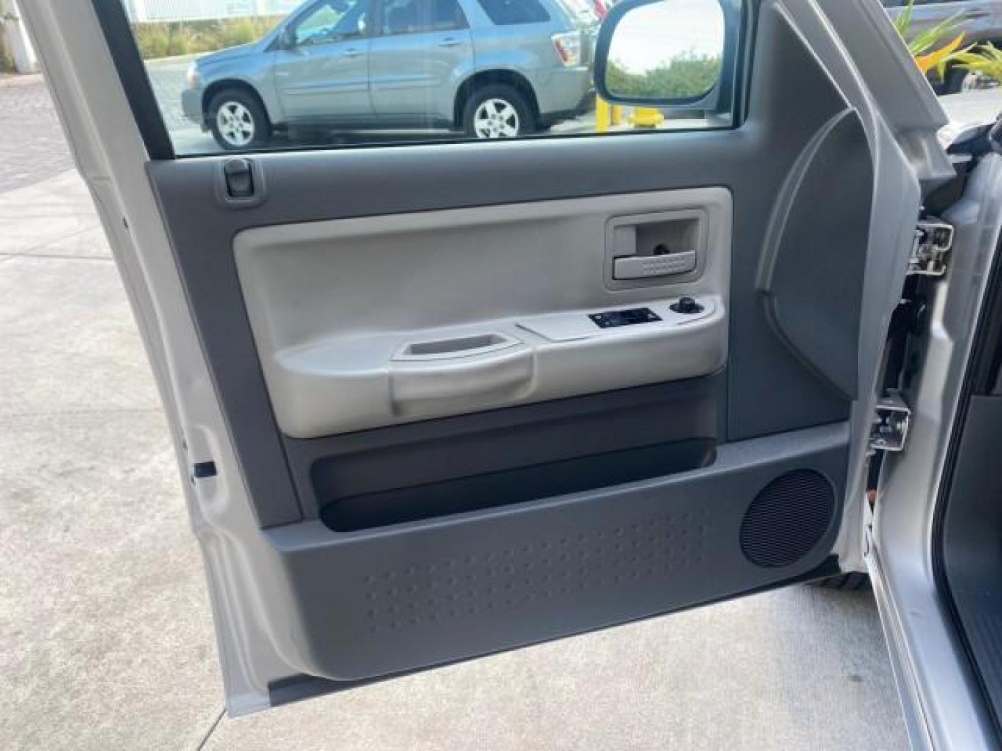 2006 Bright Silver Metallic /Med Slate Gray Dodge Dakota SLT CLUB CAB LOW MILES 55,990 (1D7HE42K06S) with an 3.7L V6 Magnum Engine engine, Automatic transmission, located at 4701 North Dixie Hwy, Pompano Beach, FL, 33064, (954) 422-2889, 26.240938, -80.123474 - OUR WEBPAGE FLORIDACARS1.COM HAS OVER 100 PHOTOS AND FREE CARFAX LINK 2006 DODGE DAKOTA SLT 1 OWNER CLUB CAB 4 DOOR ALL DOORS OPEN VIN: 1D7HE42K06S506201 1 D 7 H E 4 2 K 0 6 S 5 0 6 2 0 1 CLUB CAB PICKUP 3.7L V6 F OHV GASOLINE 22 MPG REAR WHEEL DRIVE Features ABS Brakes Air Conditioning Alloy Wheels- Photo#41