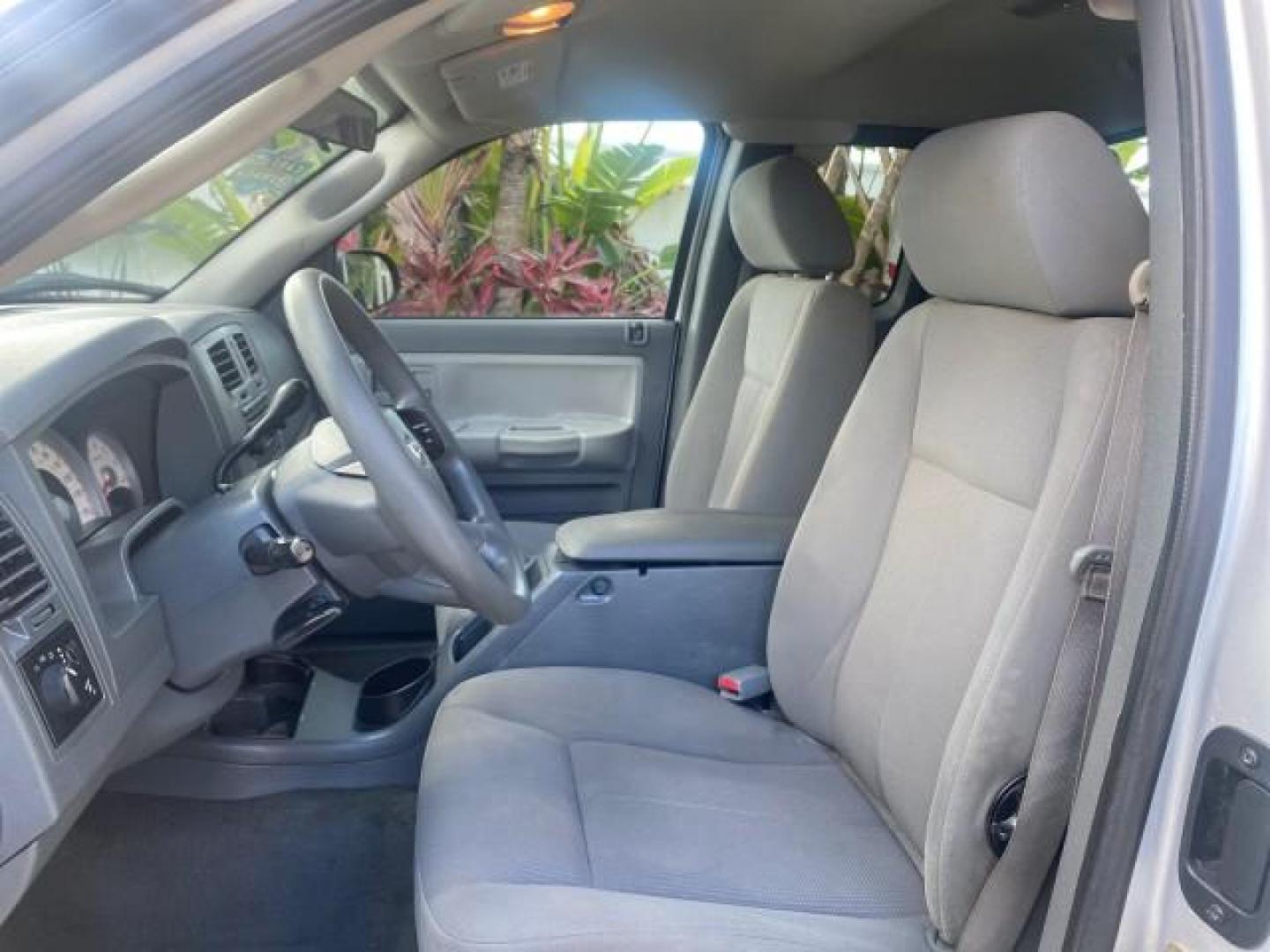 2006 Bright Silver Metallic /Med Slate Gray Dodge Dakota SLT CLUB CAB LOW MILES 55,990 (1D7HE42K06S) with an 3.7L V6 Magnum Engine engine, Automatic transmission, located at 4701 North Dixie Hwy, Pompano Beach, FL, 33064, (954) 422-2889, 26.240938, -80.123474 - OUR WEBPAGE FLORIDACARS1.COM HAS OVER 100 PHOTOS AND FREE CARFAX LINK 2006 DODGE DAKOTA SLT 1 OWNER CLUB CAB 4 DOOR ALL DOORS OPEN VIN: 1D7HE42K06S506201 1 D 7 H E 4 2 K 0 6 S 5 0 6 2 0 1 CLUB CAB PICKUP 3.7L V6 F OHV GASOLINE 22 MPG REAR WHEEL DRIVE Features ABS Brakes Air Conditioning Alloy Wheels- Photo#42