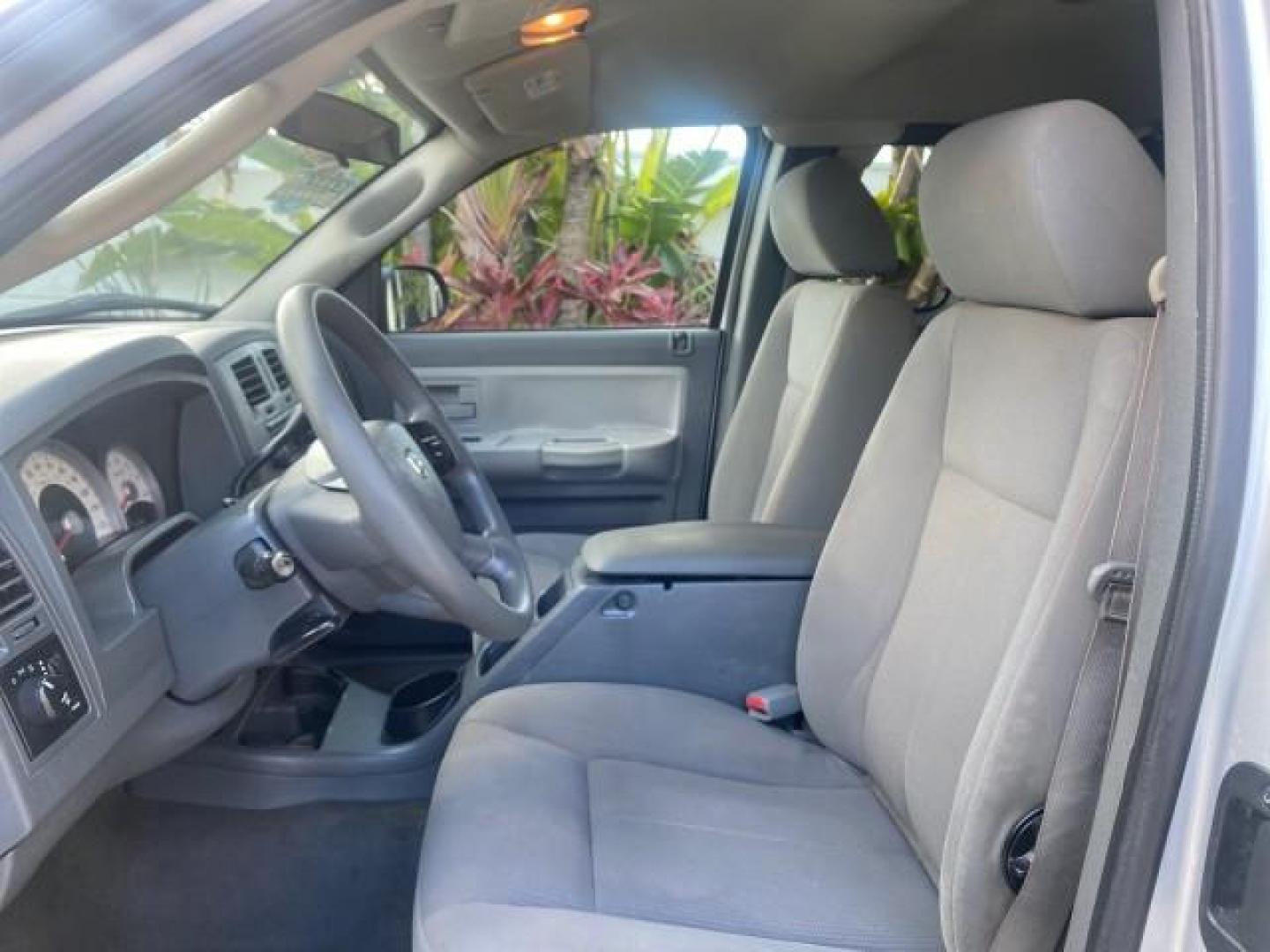 2006 Bright Silver Metallic /Med Slate Gray Dodge Dakota SLT CLUB CAB LOW MILES 55,990 (1D7HE42K06S) with an 3.7L V6 Magnum Engine engine, Automatic transmission, located at 4701 North Dixie Hwy, Pompano Beach, FL, 33064, (954) 422-2889, 26.240938, -80.123474 - OUR WEBPAGE FLORIDACARS1.COM HAS OVER 100 PHOTOS AND FREE CARFAX LINK 2006 DODGE DAKOTA SLT 1 OWNER CLUB CAB 4 DOOR ALL DOORS OPEN VIN: 1D7HE42K06S506201 1 D 7 H E 4 2 K 0 6 S 5 0 6 2 0 1 CLUB CAB PICKUP 3.7L V6 F OHV GASOLINE 22 MPG REAR WHEEL DRIVE Features ABS Brakes Air Conditioning Alloy Wheels- Photo#43