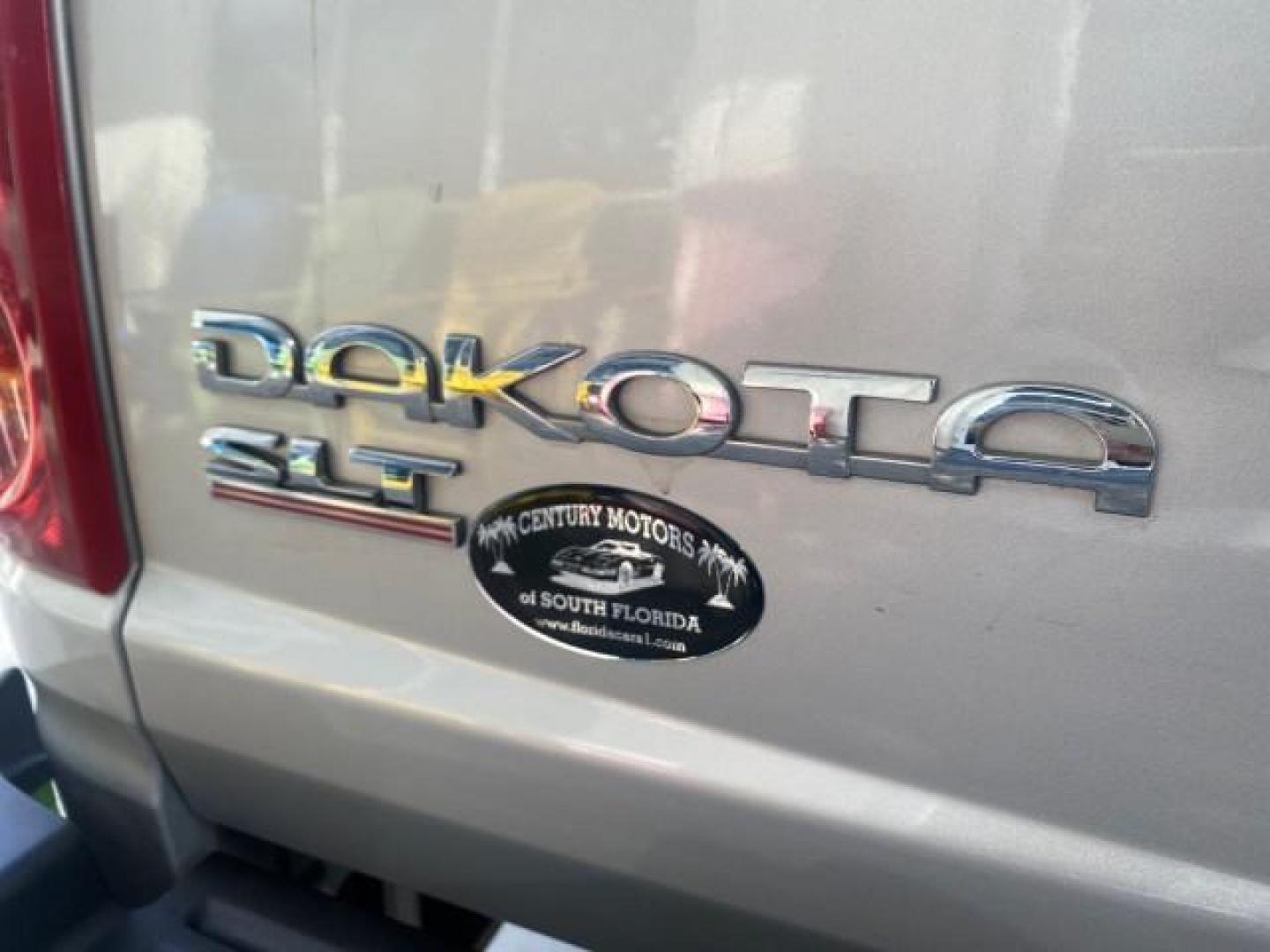 2006 Bright Silver Metallic /Med Slate Gray Dodge Dakota SLT CLUB CAB LOW MILES 55,990 (1D7HE42K06S) with an 3.7L V6 Magnum Engine engine, Automatic transmission, located at 4701 North Dixie Hwy, Pompano Beach, FL, 33064, (954) 422-2889, 26.240938, -80.123474 - OUR WEBPAGE FLORIDACARS1.COM HAS OVER 100 PHOTOS AND FREE CARFAX LINK 2006 DODGE DAKOTA SLT 1 OWNER CLUB CAB 4 DOOR ALL DOORS OPEN VIN: 1D7HE42K06S506201 1 D 7 H E 4 2 K 0 6 S 5 0 6 2 0 1 CLUB CAB PICKUP 3.7L V6 F OHV GASOLINE 22 MPG REAR WHEEL DRIVE Features ABS Brakes Air Conditioning Alloy Wheels- Photo#90