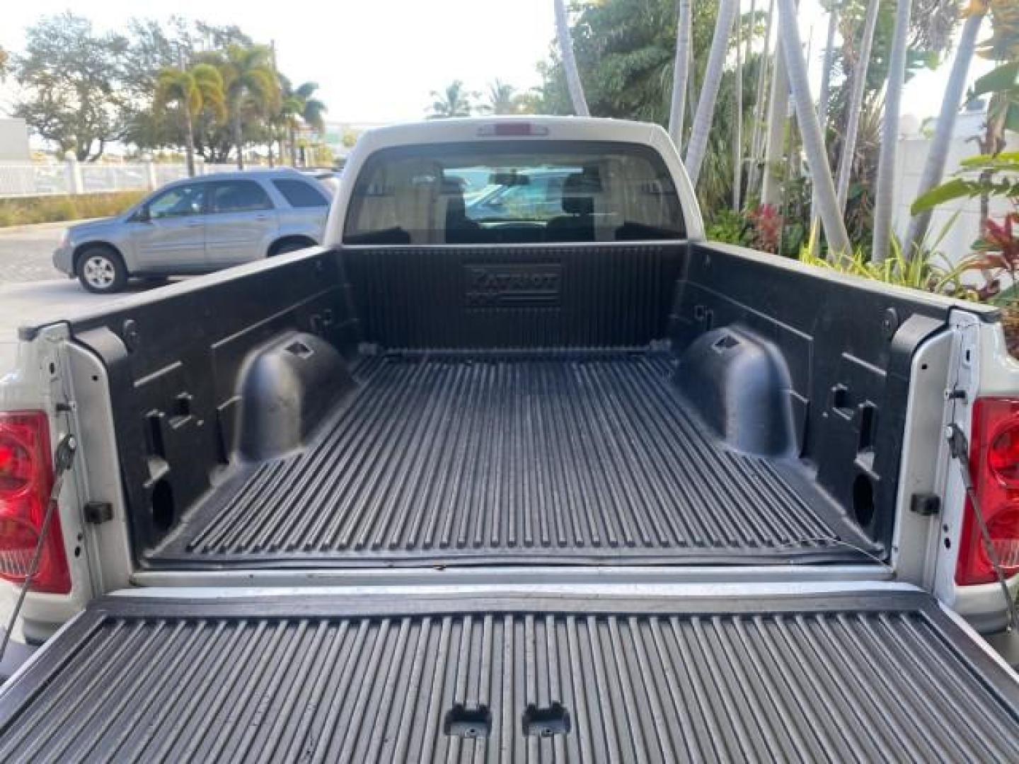 2006 Bright Silver Metallic /Med Slate Gray Dodge Dakota SLT CLUB CAB LOW MILES 55,990 (1D7HE42K06S) with an 3.7L V6 Magnum Engine engine, Automatic transmission, located at 4701 North Dixie Hwy, Pompano Beach, FL, 33064, (954) 422-2889, 26.240938, -80.123474 - OUR WEBPAGE FLORIDACARS1.COM HAS OVER 100 PHOTOS AND FREE CARFAX LINK 2006 DODGE DAKOTA SLT 1 OWNER CLUB CAB 4 DOOR ALL DOORS OPEN VIN: 1D7HE42K06S506201 1 D 7 H E 4 2 K 0 6 S 5 0 6 2 0 1 CLUB CAB PICKUP 3.7L V6 F OHV GASOLINE 22 MPG REAR WHEEL DRIVE Features ABS Brakes Air Conditioning Alloy Wheels- Photo#94