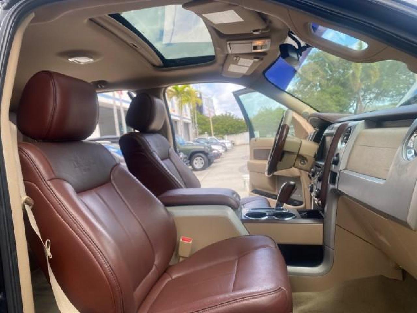 2013 Tuxedo Black Metallic /Chaparral w/Pale Adobe Interior Ford F-150 King Ranch LOW MILES 60,151 1 OWNER (1FTFW1CF6DK) with an 5.0L V8 FFV Engine engine, Automatic transmission, located at 4701 North Dixie Hwy, Pompano Beach, FL, 33064, (954) 422-2889, 26.240938, -80.123474 - OUR WEBPAGE FLORIDACARS1.COM HAS OVER 100 PHOTOS AND FREE CARFAX LINK 2013 FORD F-150 KING RANCH 1 OWNER FLORIDA SUNROOF LOADED VIN: 1FTFW1CF6DKF83375 1 F T F W 1 C F 6 D K F 8 3 3 7 5 CREW PICKUP 5.0L V8 F DOHC 32V FLEX FUEL 21 MPG REAR WHEEL DRIVE Features A/C Seat(s) ABS Brakes Air Conditioning A - Photo#13