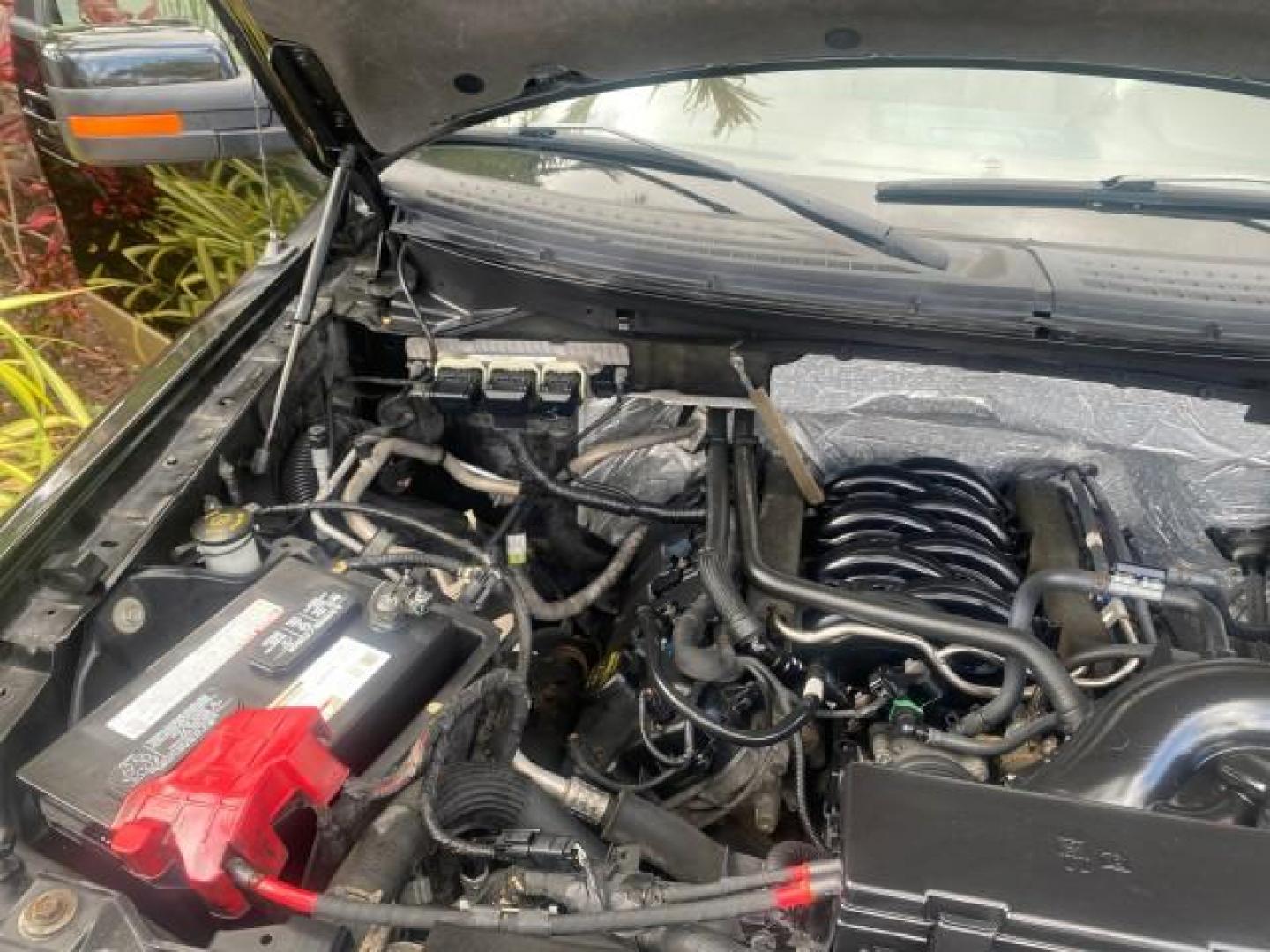 2013 Tuxedo Black Metallic /Chaparral w/Pale Adobe Interior Ford F-150 King Ranch LOW MILES 60,151 1 OWNER (1FTFW1CF6DK) with an 5.0L V8 FFV Engine engine, Automatic transmission, located at 4701 North Dixie Hwy, Pompano Beach, FL, 33064, (954) 422-2889, 26.240938, -80.123474 - OUR WEBPAGE FLORIDACARS1.COM HAS OVER 100 PHOTOS AND FREE CARFAX LINK 2013 FORD F-150 KING RANCH 1 OWNER FLORIDA SUNROOF LOADED VIN: 1FTFW1CF6DKF83375 1 F T F W 1 C F 6 D K F 8 3 3 7 5 CREW PICKUP 5.0L V8 F DOHC 32V FLEX FUEL 21 MPG REAR WHEEL DRIVE Features A/C Seat(s) ABS Brakes Air Conditioning A - Photo#25