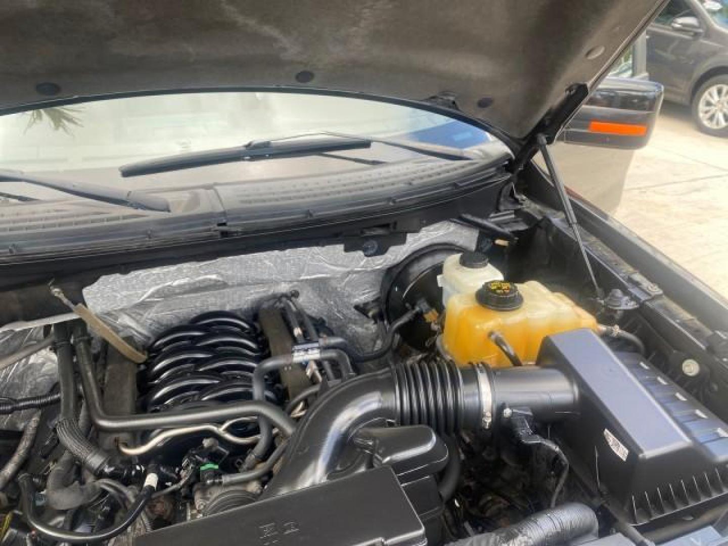 2013 Tuxedo Black Metallic /Chaparral w/Pale Adobe Interior Ford F-150 King Ranch LOW MILES 60,151 1 OWNER (1FTFW1CF6DK) with an 5.0L V8 FFV Engine engine, Automatic transmission, located at 4701 North Dixie Hwy, Pompano Beach, FL, 33064, (954) 422-2889, 26.240938, -80.123474 - OUR WEBPAGE FLORIDACARS1.COM HAS OVER 100 PHOTOS AND FREE CARFAX LINK 2013 FORD F-150 KING RANCH 1 OWNER FLORIDA SUNROOF LOADED VIN: 1FTFW1CF6DKF83375 1 F T F W 1 C F 6 D K F 8 3 3 7 5 CREW PICKUP 5.0L V8 F DOHC 32V FLEX FUEL 21 MPG REAR WHEEL DRIVE Features A/C Seat(s) ABS Brakes Air Conditioning A - Photo#26