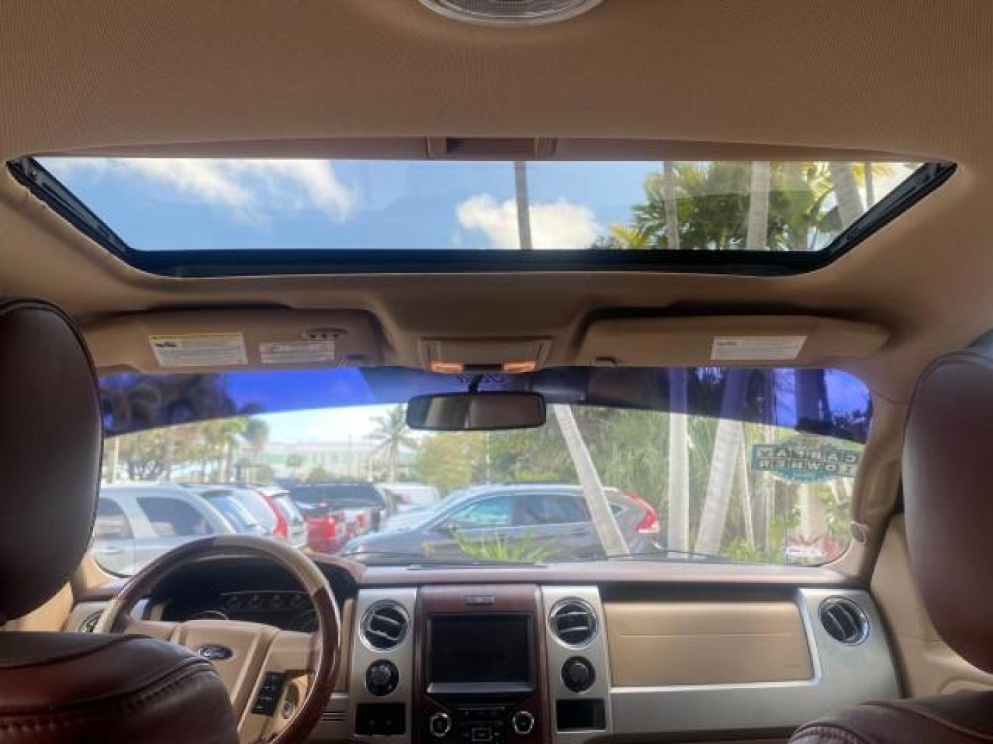 2013 Tuxedo Black Metallic /Chaparral w/Pale Adobe Interior Ford F-150 King Ranch LOW MILES 60,151 1 OWNER (1FTFW1CF6DK) with an 5.0L V8 FFV Engine engine, Automatic transmission, located at 4701 North Dixie Hwy, Pompano Beach, FL, 33064, (954) 422-2889, 26.240938, -80.123474 - OUR WEBPAGE FLORIDACARS1.COM HAS OVER 100 PHOTOS AND FREE CARFAX LINK 2013 FORD F-150 KING RANCH 1 OWNER FLORIDA SUNROOF LOADED VIN: 1FTFW1CF6DKF83375 1 F T F W 1 C F 6 D K F 8 3 3 7 5 CREW PICKUP 5.0L V8 F DOHC 32V FLEX FUEL 21 MPG REAR WHEEL DRIVE Features A/C Seat(s) ABS Brakes Air Conditioning A - Photo#90