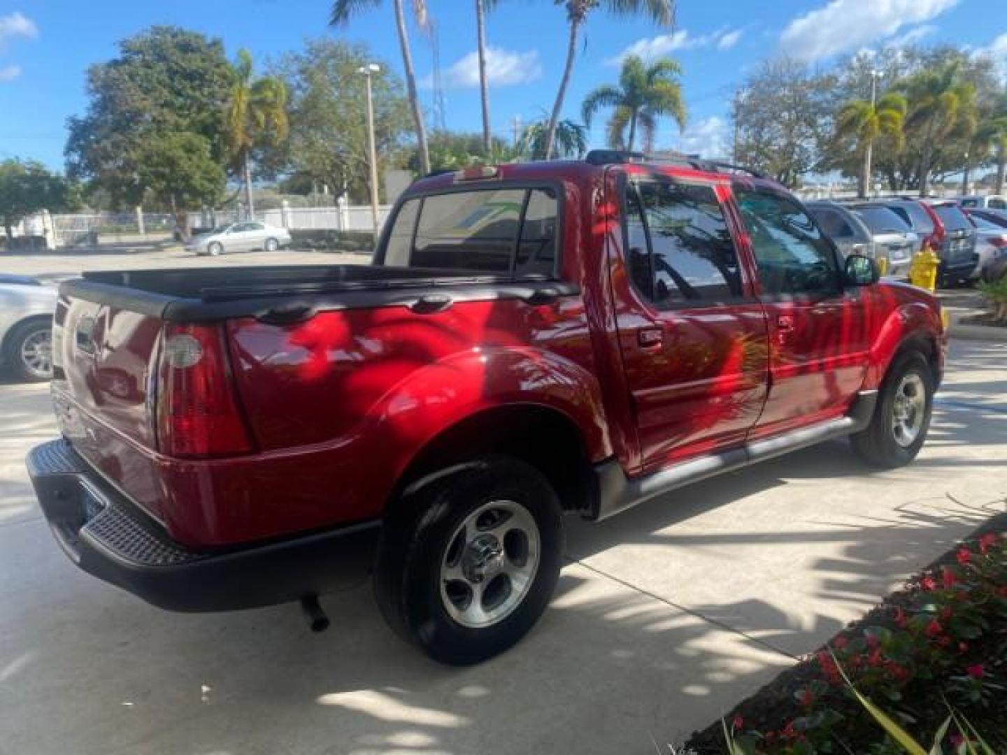 2005 Bright Red /Medium Dark Flint Ford Explorer Sport Trac PU XLS LOW MILES 72,457 (1FMZU67K85U) with an 4.0L SOHC V6 Engine engine, Automatic transmission, located at 4701 North Dixie Hwy, Pompano Beach, FL, 33064, (954) 422-2889, 26.240938, -80.123474 - OUR WEBPAGE FLORIDACARS1.COM HAS OVER 100 PHOTOS AND FREE CARFAX LINK 2005 FORD EXPLORER SPORT TRAC XLS PICKUP VIN: 1FMZU67K85UB51993 1 F M Z U 6 7 K 8 5 U B 5 1 9 9 3 SPORT PICKUP 4.0L V6 F FLEX FUEL 21 MPG REAR WHEEL DRIVE Features ABS Brakes Air Conditioning Alloy Wheels AM/FM Stereo Automatic Tr - Photo#7