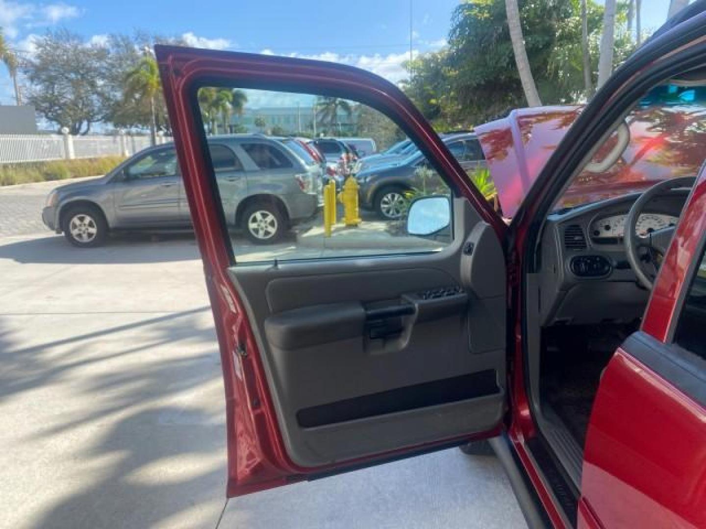2005 Bright Red /Medium Dark Flint Ford Explorer Sport Trac PU XLS LOW MILES 72,457 (1FMZU67K85U) with an 4.0L SOHC V6 Engine engine, Automatic transmission, located at 4701 North Dixie Hwy, Pompano Beach, FL, 33064, (954) 422-2889, 26.240938, -80.123474 - OUR WEBPAGE FLORIDACARS1.COM HAS OVER 100 PHOTOS AND FREE CARFAX LINK 2005 FORD EXPLORER SPORT TRAC XLS PICKUP VIN: 1FMZU67K85UB51993 1 F M Z U 6 7 K 8 5 U B 5 1 9 9 3 SPORT PICKUP 4.0L V6 F FLEX FUEL 21 MPG REAR WHEEL DRIVE Features ABS Brakes Air Conditioning Alloy Wheels AM/FM Stereo Automatic Tr - Photo#9