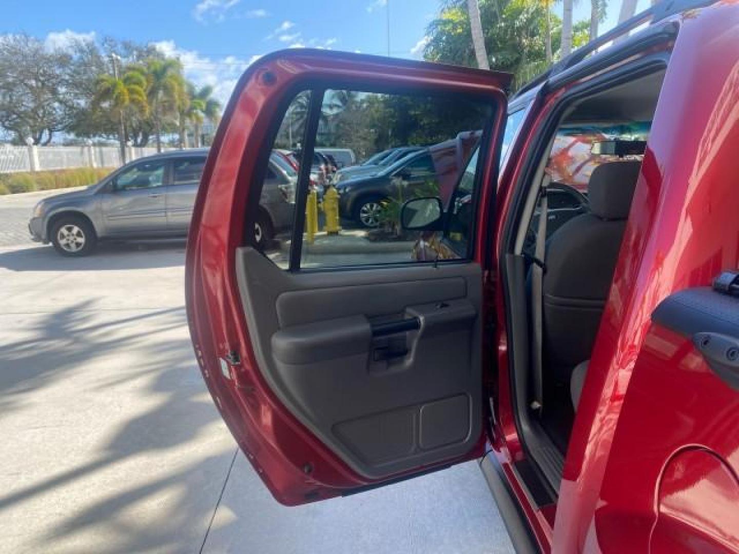 2005 Bright Red /Medium Dark Flint Ford Explorer Sport Trac PU XLS LOW MILES 72,457 (1FMZU67K85U) with an 4.0L SOHC V6 Engine engine, Automatic transmission, located at 4701 North Dixie Hwy, Pompano Beach, FL, 33064, (954) 422-2889, 26.240938, -80.123474 - OUR WEBPAGE FLORIDACARS1.COM HAS OVER 100 PHOTOS AND FREE CARFAX LINK 2005 FORD EXPLORER SPORT TRAC XLS PICKUP VIN: 1FMZU67K85UB51993 1 F M Z U 6 7 K 8 5 U B 5 1 9 9 3 SPORT PICKUP 4.0L V6 F FLEX FUEL 21 MPG REAR WHEEL DRIVE Features ABS Brakes Air Conditioning Alloy Wheels AM/FM Stereo Automatic Tr - Photo#13