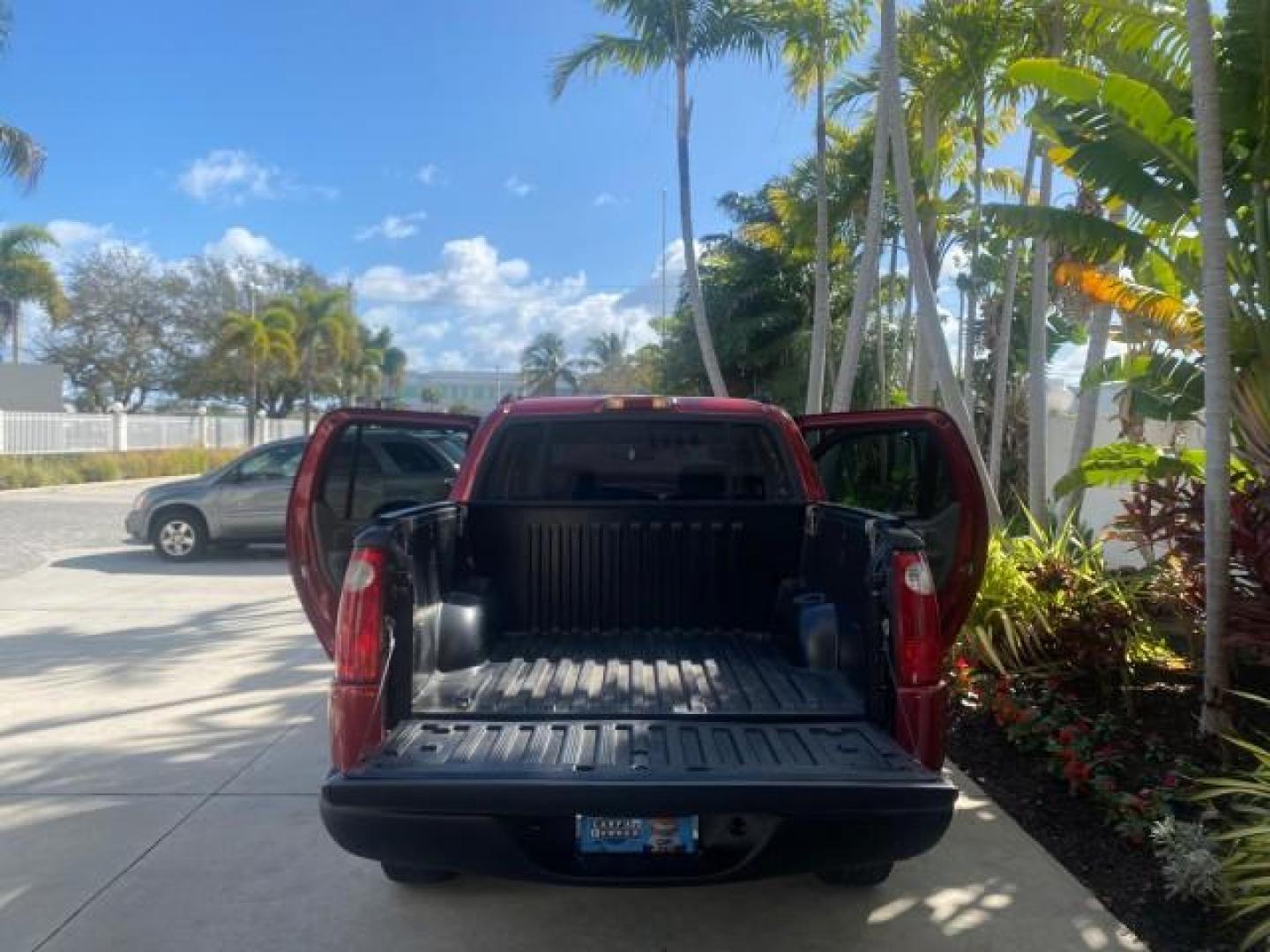 2005 Bright Red /Medium Dark Flint Ford Explorer Sport Trac PU XLS LOW MILES 72,457 (1FMZU67K85U) with an 4.0L SOHC V6 Engine engine, Automatic transmission, located at 4701 North Dixie Hwy, Pompano Beach, FL, 33064, (954) 422-2889, 26.240938, -80.123474 - OUR WEBPAGE FLORIDACARS1.COM HAS OVER 100 PHOTOS AND FREE CARFAX LINK 2005 FORD EXPLORER SPORT TRAC XLS PICKUP VIN: 1FMZU67K85UB51993 1 F M Z U 6 7 K 8 5 U B 5 1 9 9 3 SPORT PICKUP 4.0L V6 F FLEX FUEL 21 MPG REAR WHEEL DRIVE Features ABS Brakes Air Conditioning Alloy Wheels AM/FM Stereo Automatic Tr - Photo#15