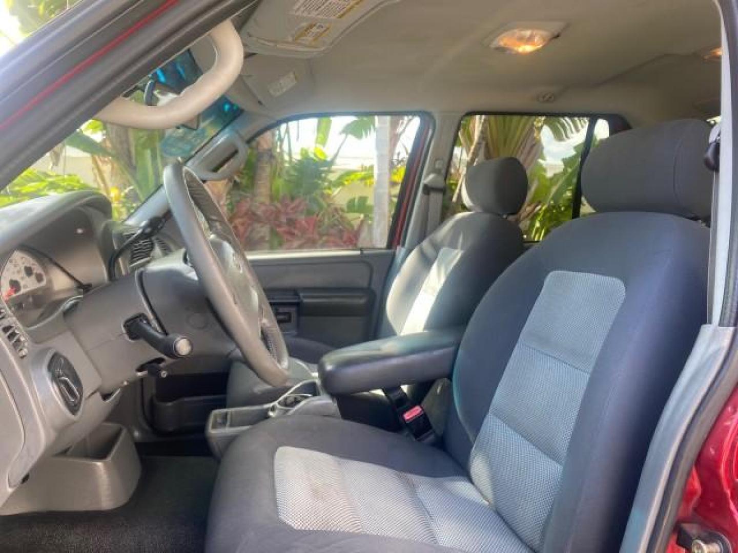 2005 Bright Red /Medium Dark Flint Ford Explorer Sport Trac PU XLS LOW MILES 72,457 (1FMZU67K85U) with an 4.0L SOHC V6 Engine engine, Automatic transmission, located at 4701 North Dixie Hwy, Pompano Beach, FL, 33064, (954) 422-2889, 26.240938, -80.123474 - OUR WEBPAGE FLORIDACARS1.COM HAS OVER 100 PHOTOS AND FREE CARFAX LINK 2005 FORD EXPLORER SPORT TRAC XLS PICKUP VIN: 1FMZU67K85UB51993 1 F M Z U 6 7 K 8 5 U B 5 1 9 9 3 SPORT PICKUP 4.0L V6 F FLEX FUEL 21 MPG REAR WHEEL DRIVE Features ABS Brakes Air Conditioning Alloy Wheels AM/FM Stereo Automatic Tr - Photo#44