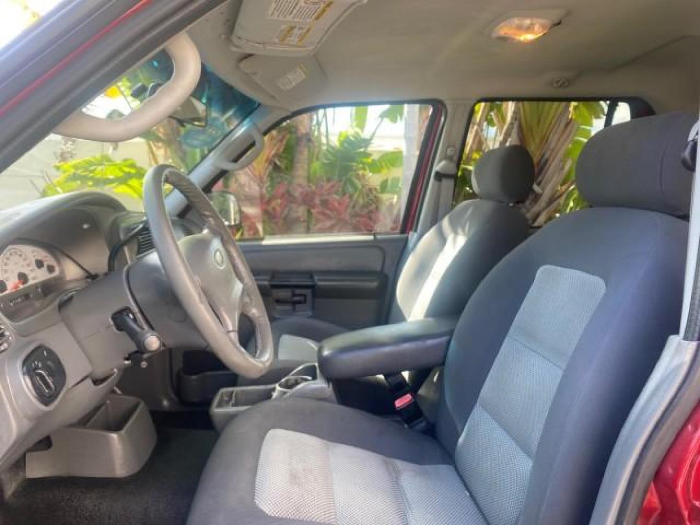 2005 Bright Red /Medium Dark Flint Ford Explorer Sport Trac PU XLS LOW MILES 72,457 (1FMZU67K85U) with an 4.0L SOHC V6 Engine engine, Automatic transmission, located at 4701 North Dixie Hwy, Pompano Beach, FL, 33064, (954) 422-2889, 26.240938, -80.123474 - OUR WEBPAGE FLORIDACARS1.COM HAS OVER 100 PHOTOS AND FREE CARFAX LINK 2005 FORD EXPLORER SPORT TRAC XLS PICKUP VIN: 1FMZU67K85UB51993 1 F M Z U 6 7 K 8 5 U B 5 1 9 9 3 SPORT PICKUP 4.0L V6 F FLEX FUEL 21 MPG REAR WHEEL DRIVE Features ABS Brakes Air Conditioning Alloy Wheels AM/FM Stereo Automatic Tr - Photo#45