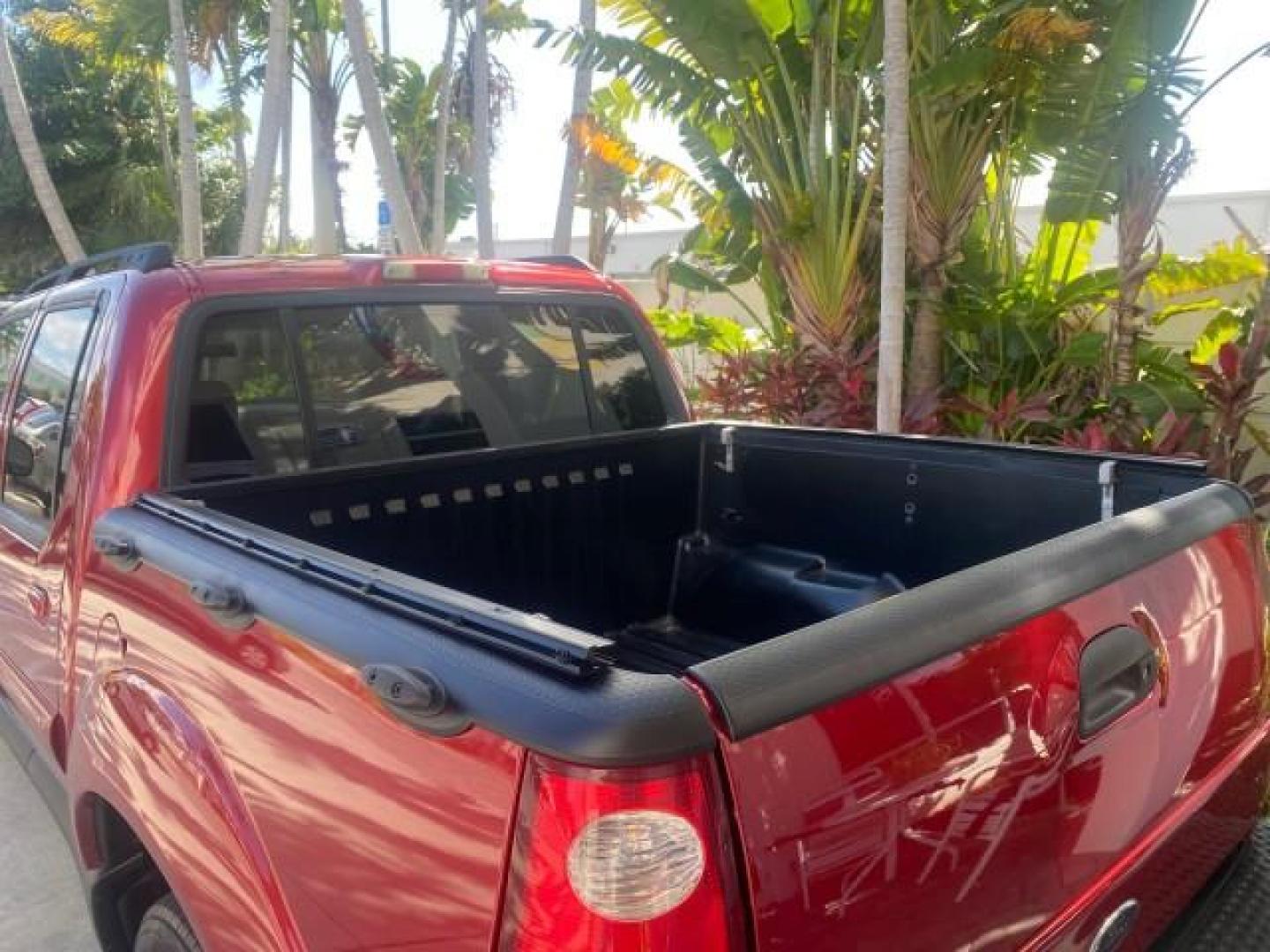 2005 Bright Red /Medium Dark Flint Ford Explorer Sport Trac PU XLS LOW MILES 72,457 (1FMZU67K85U) with an 4.0L SOHC V6 Engine engine, Automatic transmission, located at 4701 North Dixie Hwy, Pompano Beach, FL, 33064, (954) 422-2889, 26.240938, -80.123474 - OUR WEBPAGE FLORIDACARS1.COM HAS OVER 100 PHOTOS AND FREE CARFAX LINK 2005 FORD EXPLORER SPORT TRAC XLS PICKUP VIN: 1FMZU67K85UB51993 1 F M Z U 6 7 K 8 5 U B 5 1 9 9 3 SPORT PICKUP 4.0L V6 F FLEX FUEL 21 MPG REAR WHEEL DRIVE Features ABS Brakes Air Conditioning Alloy Wheels AM/FM Stereo Automatic Tr - Photo#82