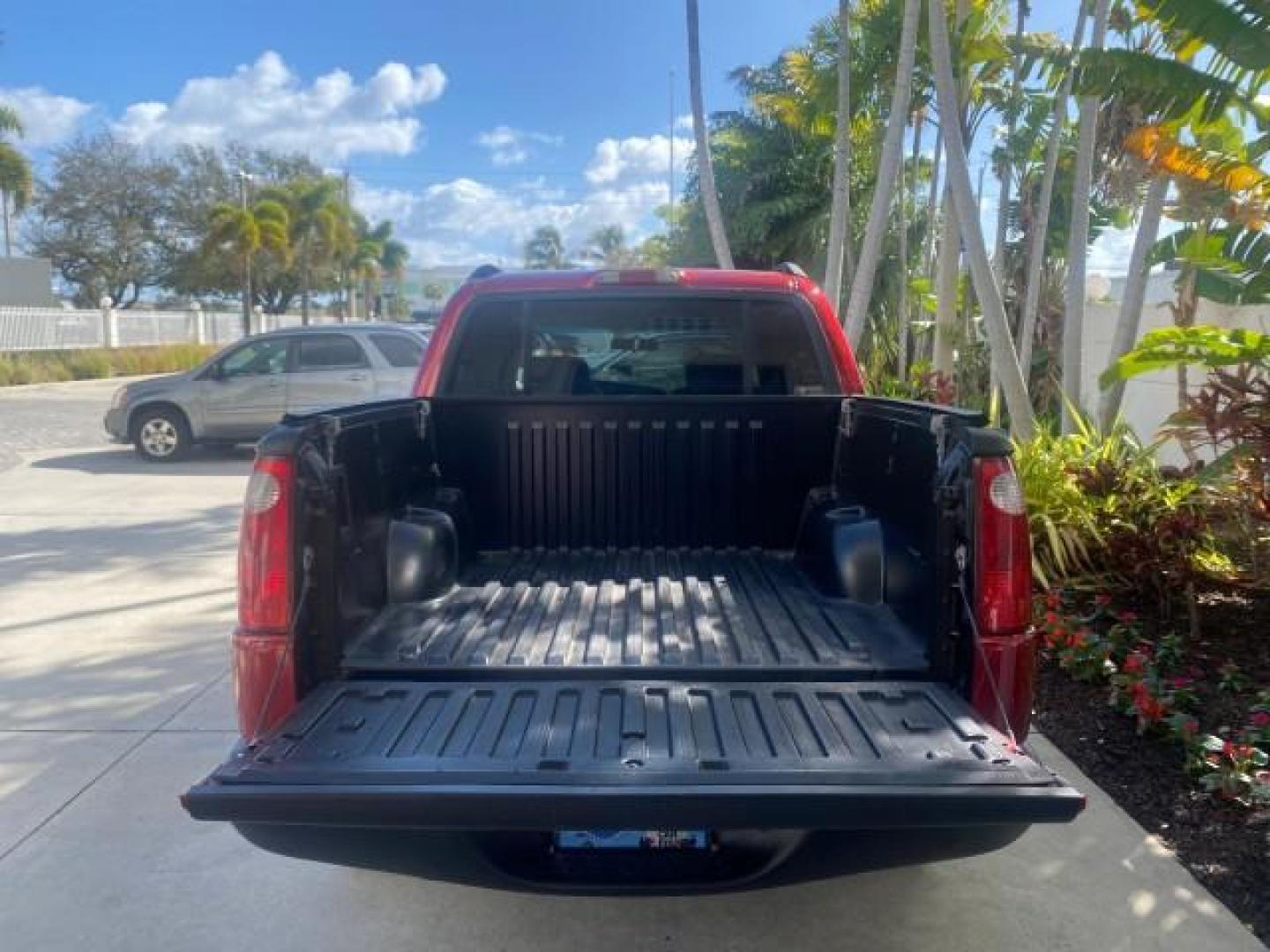 2005 Bright Red /Medium Dark Flint Ford Explorer Sport Trac PU XLS LOW MILES 72,457 (1FMZU67K85U) with an 4.0L SOHC V6 Engine engine, Automatic transmission, located at 4701 North Dixie Hwy, Pompano Beach, FL, 33064, (954) 422-2889, 26.240938, -80.123474 - OUR WEBPAGE FLORIDACARS1.COM HAS OVER 100 PHOTOS AND FREE CARFAX LINK 2005 FORD EXPLORER SPORT TRAC XLS PICKUP VIN: 1FMZU67K85UB51993 1 F M Z U 6 7 K 8 5 U B 5 1 9 9 3 SPORT PICKUP 4.0L V6 F FLEX FUEL 21 MPG REAR WHEEL DRIVE Features ABS Brakes Air Conditioning Alloy Wheels AM/FM Stereo Automatic Tr - Photo#87