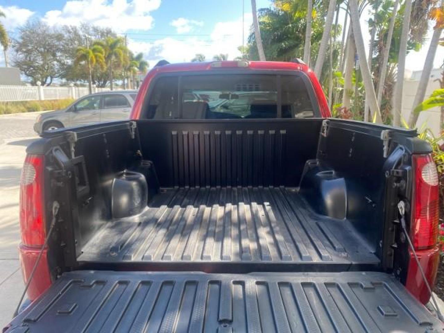 2005 Bright Red /Medium Dark Flint Ford Explorer Sport Trac PU XLS LOW MILES 72,457 (1FMZU67K85U) with an 4.0L SOHC V6 Engine engine, Automatic transmission, located at 4701 North Dixie Hwy, Pompano Beach, FL, 33064, (954) 422-2889, 26.240938, -80.123474 - OUR WEBPAGE FLORIDACARS1.COM HAS OVER 100 PHOTOS AND FREE CARFAX LINK 2005 FORD EXPLORER SPORT TRAC XLS PICKUP VIN: 1FMZU67K85UB51993 1 F M Z U 6 7 K 8 5 U B 5 1 9 9 3 SPORT PICKUP 4.0L V6 F FLEX FUEL 21 MPG REAR WHEEL DRIVE Features ABS Brakes Air Conditioning Alloy Wheels AM/FM Stereo Automatic Tr - Photo#88