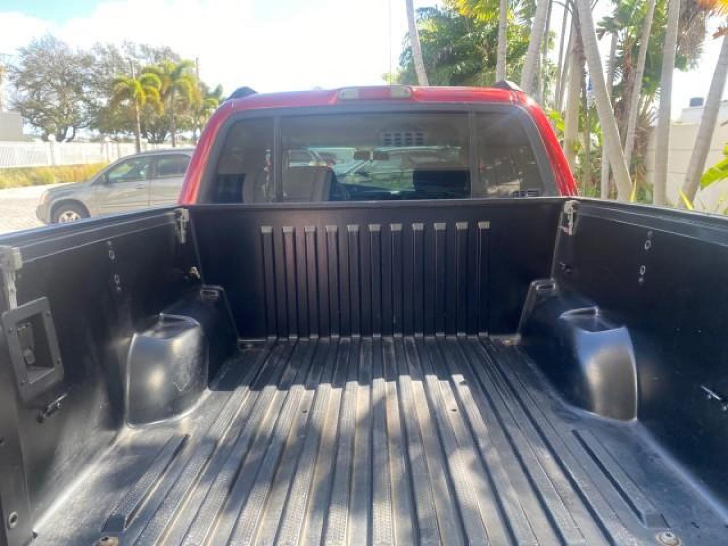 2005 Bright Red /Medium Dark Flint Ford Explorer Sport Trac PU XLS LOW MILES 72,457 (1FMZU67K85U) with an 4.0L SOHC V6 Engine engine, Automatic transmission, located at 4701 North Dixie Hwy, Pompano Beach, FL, 33064, (954) 422-2889, 26.240938, -80.123474 - OUR WEBPAGE FLORIDACARS1.COM HAS OVER 100 PHOTOS AND FREE CARFAX LINK 2005 FORD EXPLORER SPORT TRAC XLS PICKUP VIN: 1FMZU67K85UB51993 1 F M Z U 6 7 K 8 5 U B 5 1 9 9 3 SPORT PICKUP 4.0L V6 F FLEX FUEL 21 MPG REAR WHEEL DRIVE Features ABS Brakes Air Conditioning Alloy Wheels AM/FM Stereo Automatic Tr - Photo#89