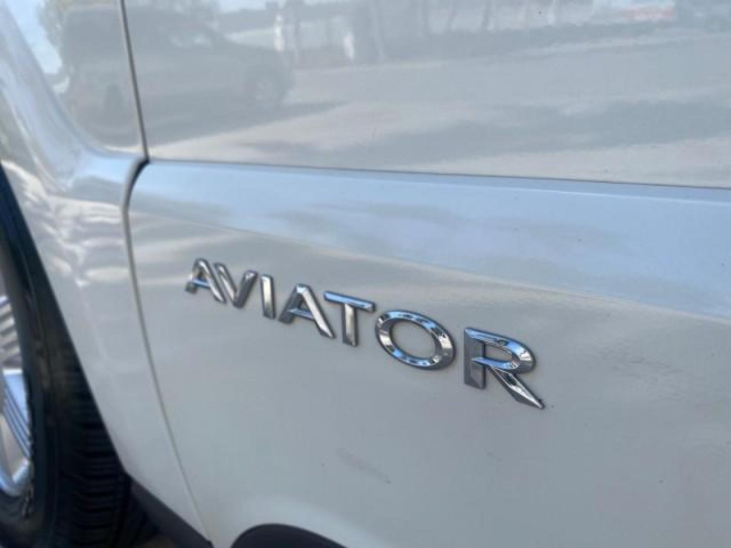 2003 Ceramic White /Light Parchment Lincoln Aviator Premium 4WD SUNROOF (5LMEU78H03Z) with an 4.6L DOHC 32-Valve V8 Engine engine, Automatic transmission, located at 4701 North Dixie Hwy, Pompano Beach, FL, 33064, (954) 422-2889, 26.240938, -80.123474 - OUR WEBPAGE FLORIDACARS1.COM HAS OVER 100 PHOTOS AND FREE CARFAX LINK 2003 LINCOLN AVIATOR PREMIUM 4WD SUNROOF $45,120 NEW TIRES LOOK VERY NICE VIN: 5LMEU78H03ZJ14425 5 L M E U 7 8 H 0 3 Z J 1 4 4 2 5 4 DOOR WAGON/SPORT UTILITY 4.6L V8 F DOHC GASOLINE 18 MPG REAR WHEEL DRIVE W/ 4X4 Features 4WD/AWD - Photo#42