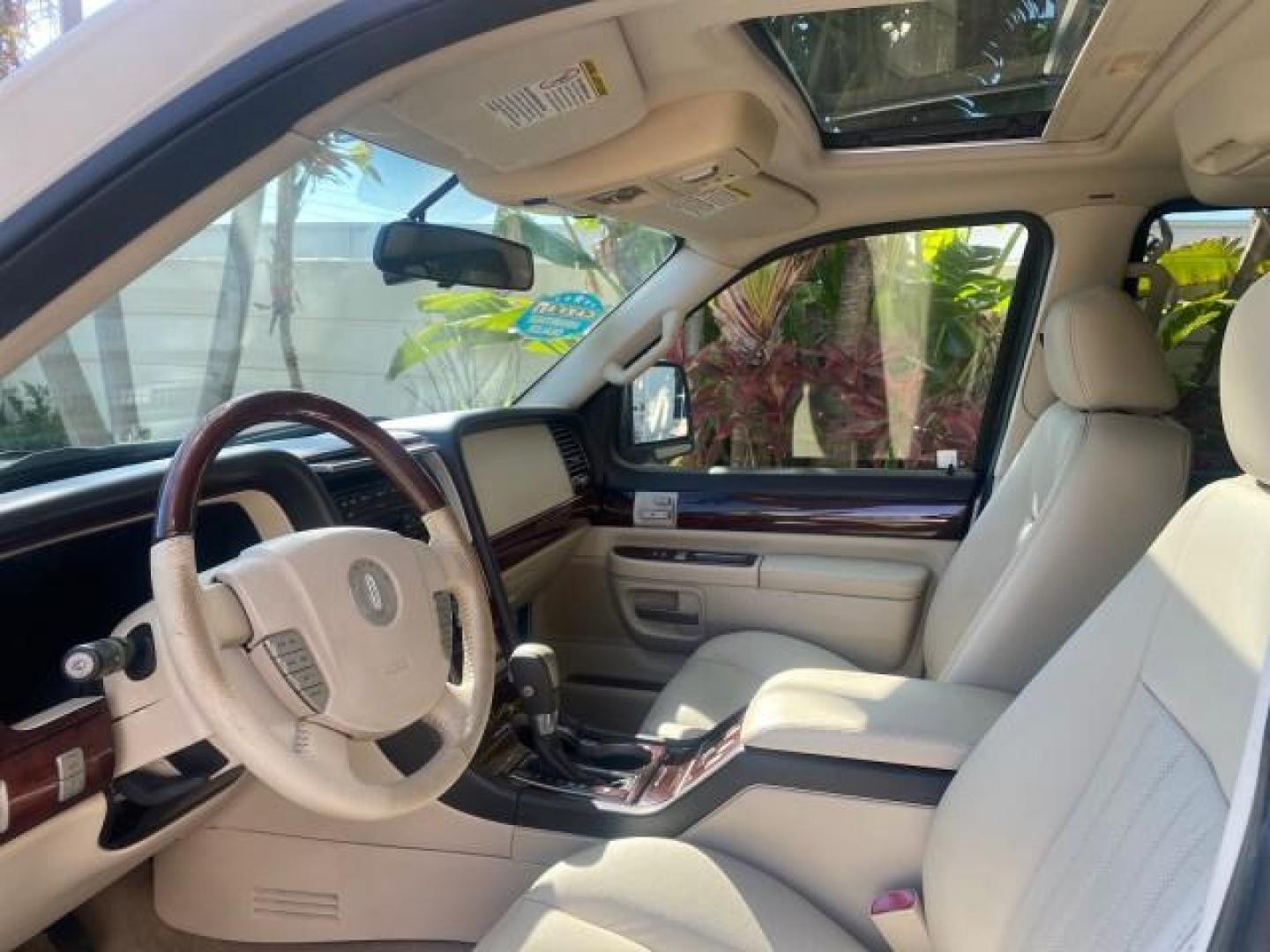 2003 Ceramic White /Light Parchment Lincoln Aviator Premium 4WD SUNROOF (5LMEU78H03Z) with an 4.6L DOHC 32-Valve V8 Engine engine, Automatic transmission, located at 4701 North Dixie Hwy, Pompano Beach, FL, 33064, (954) 422-2889, 26.240938, -80.123474 - OUR WEBPAGE FLORIDACARS1.COM HAS OVER 100 PHOTOS AND FREE CARFAX LINK 2003 LINCOLN AVIATOR PREMIUM 4WD SUNROOF $45,120 NEW TIRES LOOK VERY NICE VIN: 5LMEU78H03ZJ14425 5 L M E U 7 8 H 0 3 Z J 1 4 4 2 5 4 DOOR WAGON/SPORT UTILITY 4.6L V8 F DOHC GASOLINE 18 MPG REAR WHEEL DRIVE W/ 4X4 Features 4WD/AWD - Photo#49