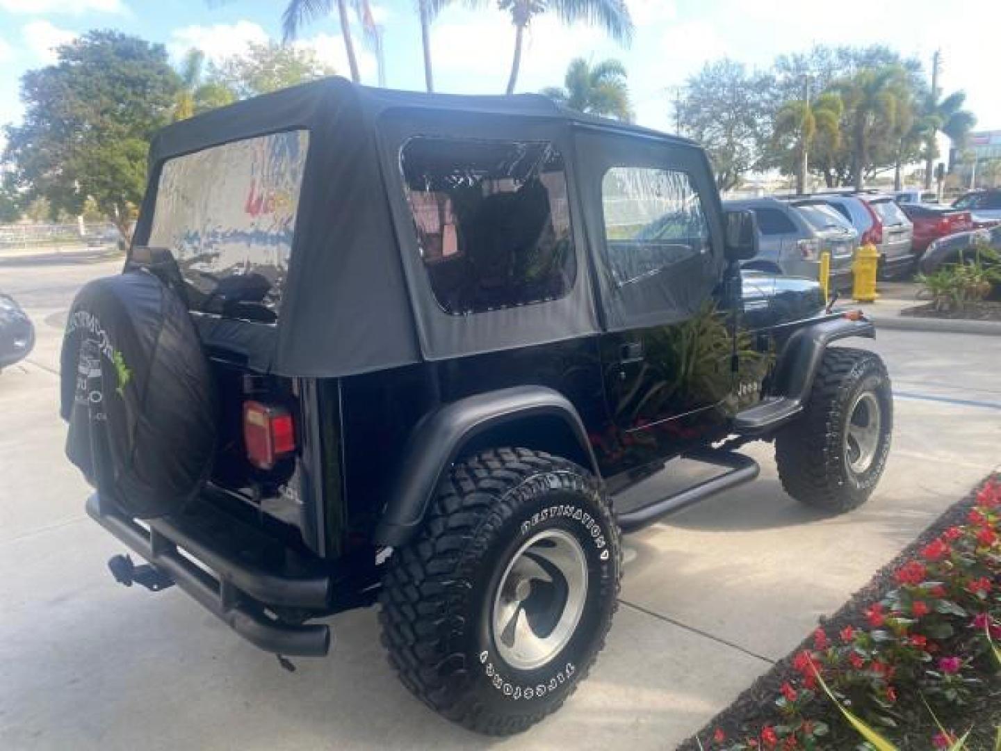 1994 Black /Gray Jeep Wrangler 4.0 6 CYL SE LOW MILES 87,813 (1J4FY29S8RP) with an 4.0L Straight 6-Cyl Engine engine, Automatic transmission, located at 4701 North Dixie Hwy, Pompano Beach, FL, 33064, (954) 422-2889, 26.240938, -80.123474 - OUR WEBPAGE FLORIDACARS1.COM HAS OVER 100 PHOTOS AND FREE CARFAX LINK 1994 JEEP WRANGLER SE AUTO AC BRAND NEW TOP WITH HARDWARE $ 2000 VALUE INCLUDED VIN: 1J4FY29S8RP433289 1 J 4 F Y 2 9 S 8 R P 4 3 3 2 8 9 UTILITY (BLAZER, JIMMY, SCOUT, ETC.) 4.0L I6 F GASOLINE REAR WHEEL DRIVE W/ 4X4 Features ABS - Photo#7