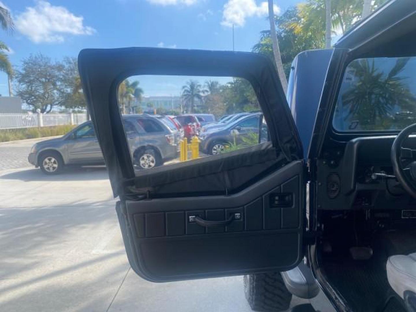 1994 Black /Gray Jeep Wrangler 4.0 6 CYL SE LOW MILES 87,813 (1J4FY29S8RP) with an 4.0L Straight 6-Cyl Engine engine, Automatic transmission, located at 4701 North Dixie Hwy, Pompano Beach, FL, 33064, (954) 422-2889, 26.240938, -80.123474 - OUR WEBPAGE FLORIDACARS1.COM HAS OVER 100 PHOTOS AND FREE CARFAX LINK 1994 JEEP WRANGLER SE AUTO AC BRAND NEW TOP WITH HARDWARE $ 2000 VALUE INCLUDED VIN: 1J4FY29S8RP433289 1 J 4 F Y 2 9 S 8 R P 4 3 3 2 8 9 UTILITY (BLAZER, JIMMY, SCOUT, ETC.) 4.0L I6 F GASOLINE REAR WHEEL DRIVE W/ 4X4 Features ABS - Photo#9