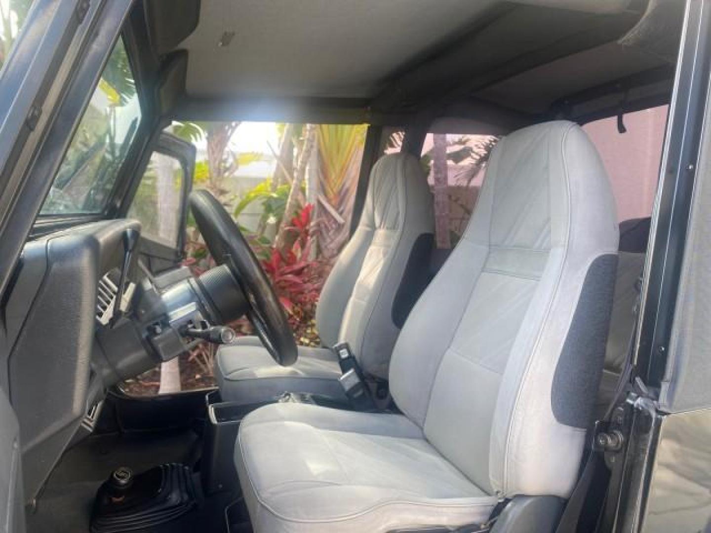 1994 Black /Gray Jeep Wrangler 4.0 6 CYL SE LOW MILES 87,813 (1J4FY29S8RP) with an 4.0L Straight 6-Cyl Engine engine, Automatic transmission, located at 4701 North Dixie Hwy, Pompano Beach, FL, 33064, (954) 422-2889, 26.240938, -80.123474 - OUR WEBPAGE FLORIDACARS1.COM HAS OVER 100 PHOTOS AND FREE CARFAX LINK 1994 JEEP WRANGLER SE AUTO AC BRAND NEW TOP WITH HARDWARE $ 2000 VALUE INCLUDED VIN: 1J4FY29S8RP433289 1 J 4 F Y 2 9 S 8 R P 4 3 3 2 8 9 UTILITY (BLAZER, JIMMY, SCOUT, ETC.) 4.0L I6 F GASOLINE REAR WHEEL DRIVE W/ 4X4 Features ABS - Photo#10