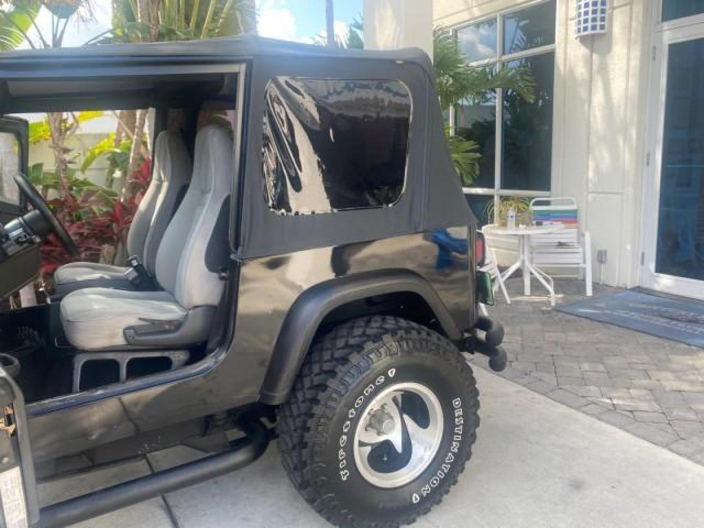 1994 Black /Gray Jeep Wrangler 4.0 6 CYL SE LOW MILES 87,813 (1J4FY29S8RP) with an 4.0L Straight 6-Cyl Engine engine, Automatic transmission, located at 4701 North Dixie Hwy, Pompano Beach, FL, 33064, (954) 422-2889, 26.240938, -80.123474 - OUR WEBPAGE FLORIDACARS1.COM HAS OVER 100 PHOTOS AND FREE CARFAX LINK 1994 JEEP WRANGLER SE AUTO AC BRAND NEW TOP WITH HARDWARE $ 2000 VALUE INCLUDED VIN: 1J4FY29S8RP433289 1 J 4 F Y 2 9 S 8 R P 4 3 3 2 8 9 UTILITY (BLAZER, JIMMY, SCOUT, ETC.) 4.0L I6 F GASOLINE REAR WHEEL DRIVE W/ 4X4 Features ABS - Photo#13