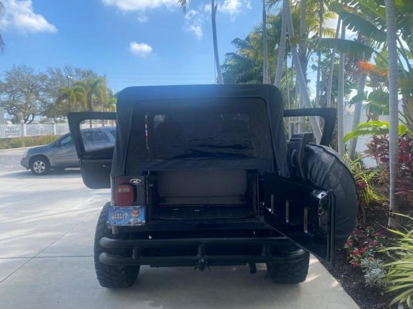 1994 Black /Gray Jeep Wrangler 4.0 6 CYL SE LOW MILES 87,813 (1J4FY29S8RP) with an 4.0L Straight 6-Cyl Engine engine, Automatic transmission, located at 4701 North Dixie Hwy, Pompano Beach, FL, 33064, (954) 422-2889, 26.240938, -80.123474 - OUR WEBPAGE FLORIDACARS1.COM HAS OVER 100 PHOTOS AND FREE CARFAX LINK 1994 JEEP WRANGLER SE AUTO AC BRAND NEW TOP WITH HARDWARE $ 2000 VALUE INCLUDED VIN: 1J4FY29S8RP433289 1 J 4 F Y 2 9 S 8 R P 4 3 3 2 8 9 UTILITY (BLAZER, JIMMY, SCOUT, ETC.) 4.0L I6 F GASOLINE REAR WHEEL DRIVE W/ 4X4 Features ABS - Photo#15