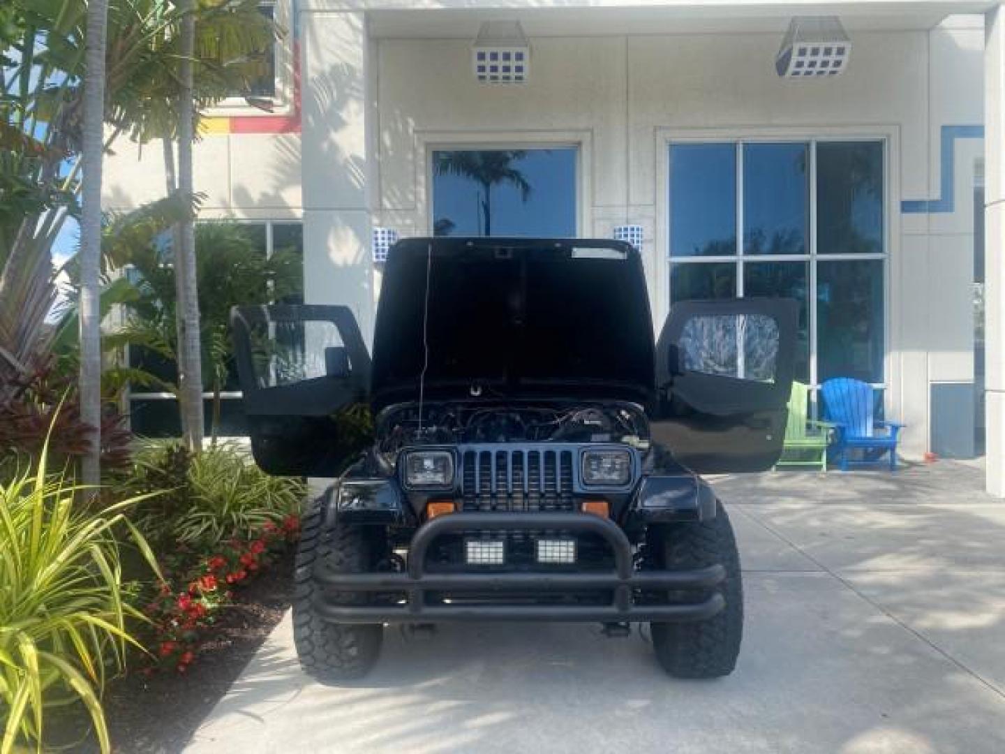 1994 Black /Gray Jeep Wrangler 4.0 6 CYL SE LOW MILES 87,813 (1J4FY29S8RP) with an 4.0L Straight 6-Cyl Engine engine, Automatic transmission, located at 4701 North Dixie Hwy, Pompano Beach, FL, 33064, (954) 422-2889, 26.240938, -80.123474 - OUR WEBPAGE FLORIDACARS1.COM HAS OVER 100 PHOTOS AND FREE CARFAX LINK 1994 JEEP WRANGLER SE AUTO AC BRAND NEW TOP WITH HARDWARE $ 2000 VALUE INCLUDED VIN: 1J4FY29S8RP433289 1 J 4 F Y 2 9 S 8 R P 4 3 3 2 8 9 UTILITY (BLAZER, JIMMY, SCOUT, ETC.) 4.0L I6 F GASOLINE REAR WHEEL DRIVE W/ 4X4 Features ABS - Photo#16