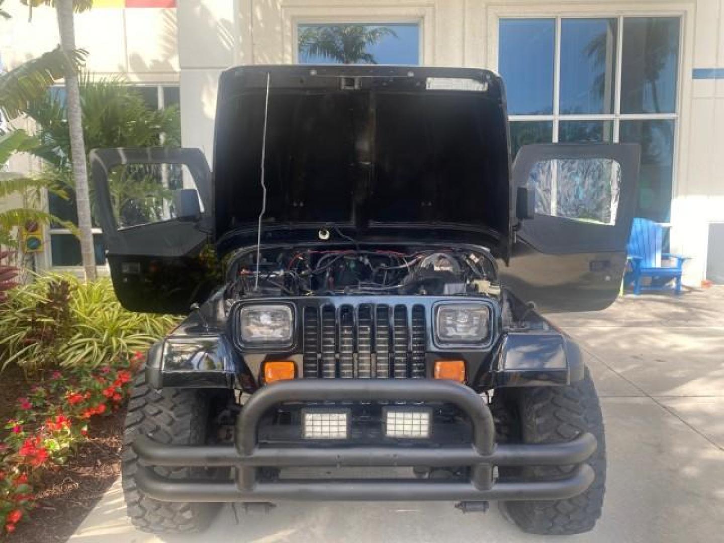 1994 Black /Gray Jeep Wrangler 4.0 6 CYL SE LOW MILES 87,813 (1J4FY29S8RP) with an 4.0L Straight 6-Cyl Engine engine, Automatic transmission, located at 4701 North Dixie Hwy, Pompano Beach, FL, 33064, (954) 422-2889, 26.240938, -80.123474 - OUR WEBPAGE FLORIDACARS1.COM HAS OVER 100 PHOTOS AND FREE CARFAX LINK 1994 JEEP WRANGLER SE AUTO AC BRAND NEW TOP WITH HARDWARE $ 2000 VALUE INCLUDED VIN: 1J4FY29S8RP433289 1 J 4 F Y 2 9 S 8 R P 4 3 3 2 8 9 UTILITY (BLAZER, JIMMY, SCOUT, ETC.) 4.0L I6 F GASOLINE REAR WHEEL DRIVE W/ 4X4 Features ABS - Photo#17
