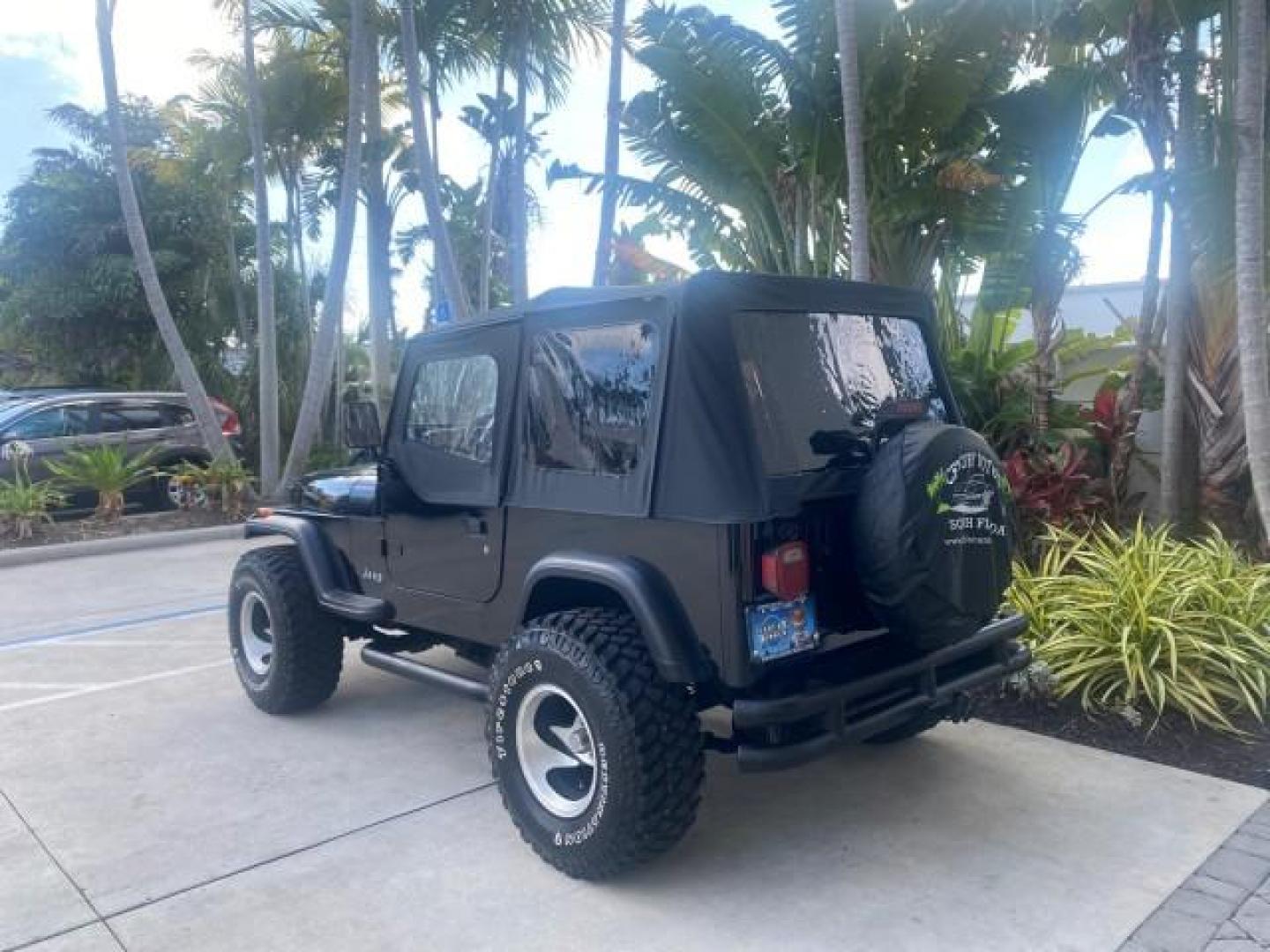 1994 Black /Gray Jeep Wrangler 4.0 6 CYL SE LOW MILES 87,813 (1J4FY29S8RP) with an 4.0L Straight 6-Cyl Engine engine, Automatic transmission, located at 4701 North Dixie Hwy, Pompano Beach, FL, 33064, (954) 422-2889, 26.240938, -80.123474 - OUR WEBPAGE FLORIDACARS1.COM HAS OVER 100 PHOTOS AND FREE CARFAX LINK 1994 JEEP WRANGLER SE AUTO AC BRAND NEW TOP WITH HARDWARE $ 2000 VALUE INCLUDED VIN: 1J4FY29S8RP433289 1 J 4 F Y 2 9 S 8 R P 4 3 3 2 8 9 UTILITY (BLAZER, JIMMY, SCOUT, ETC.) 4.0L I6 F GASOLINE REAR WHEEL DRIVE W/ 4X4 Features ABS - Photo#32