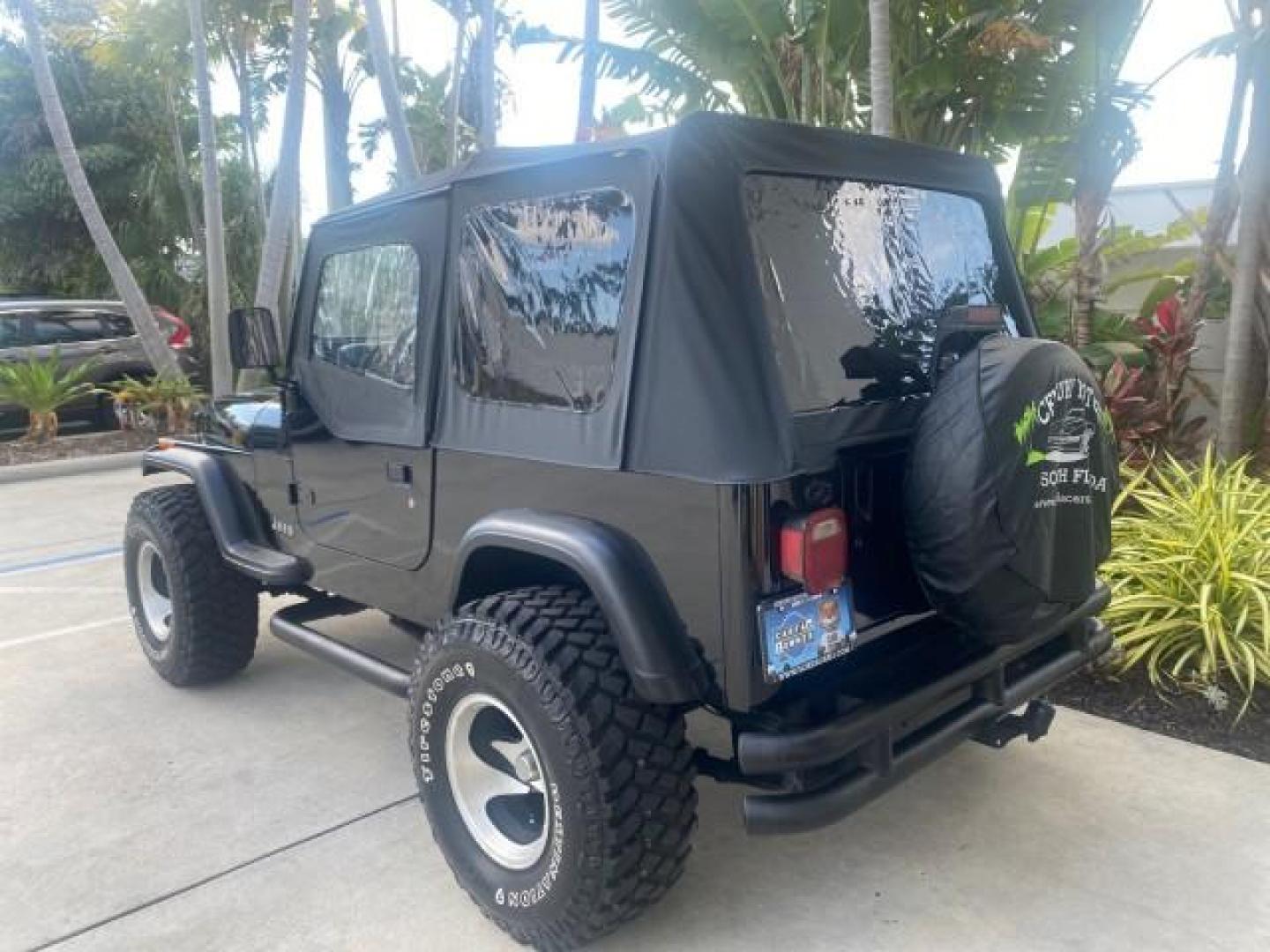 1994 Black /Gray Jeep Wrangler 4.0 6 CYL SE LOW MILES 87,813 (1J4FY29S8RP) with an 4.0L Straight 6-Cyl Engine engine, Automatic transmission, located at 4701 North Dixie Hwy, Pompano Beach, FL, 33064, (954) 422-2889, 26.240938, -80.123474 - OUR WEBPAGE FLORIDACARS1.COM HAS OVER 100 PHOTOS AND FREE CARFAX LINK 1994 JEEP WRANGLER SE AUTO AC BRAND NEW TOP WITH HARDWARE $ 2000 VALUE INCLUDED VIN: 1J4FY29S8RP433289 1 J 4 F Y 2 9 S 8 R P 4 3 3 2 8 9 UTILITY (BLAZER, JIMMY, SCOUT, ETC.) 4.0L I6 F GASOLINE REAR WHEEL DRIVE W/ 4X4 Features ABS - Photo#33