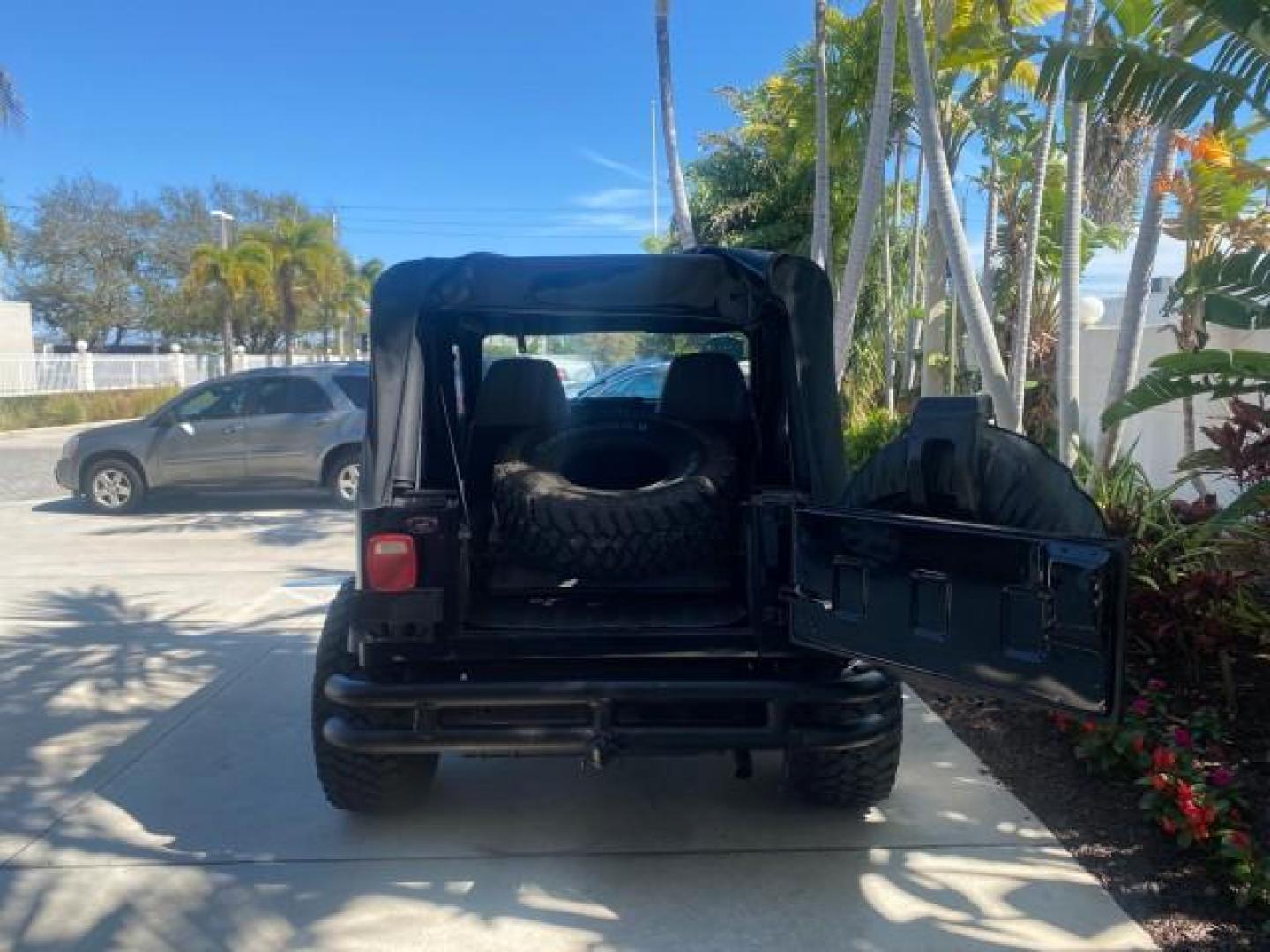 1994 Black /Gray Jeep Wrangler 4.0 6 CYL SE LOW MILES 87,813 (1J4FY29S8RP) with an 4.0L Straight 6-Cyl Engine engine, Automatic transmission, located at 4701 North Dixie Hwy, Pompano Beach, FL, 33064, (954) 422-2889, 26.240938, -80.123474 - OUR WEBPAGE FLORIDACARS1.COM HAS OVER 100 PHOTOS AND FREE CARFAX LINK 1994 JEEP WRANGLER SE AUTO AC BRAND NEW TOP WITH HARDWARE $ 2000 VALUE INCLUDED VIN: 1J4FY29S8RP433289 1 J 4 F Y 2 9 S 8 R P 4 3 3 2 8 9 UTILITY (BLAZER, JIMMY, SCOUT, ETC.) 4.0L I6 F GASOLINE REAR WHEEL DRIVE W/ 4X4 Features ABS - Photo#35
