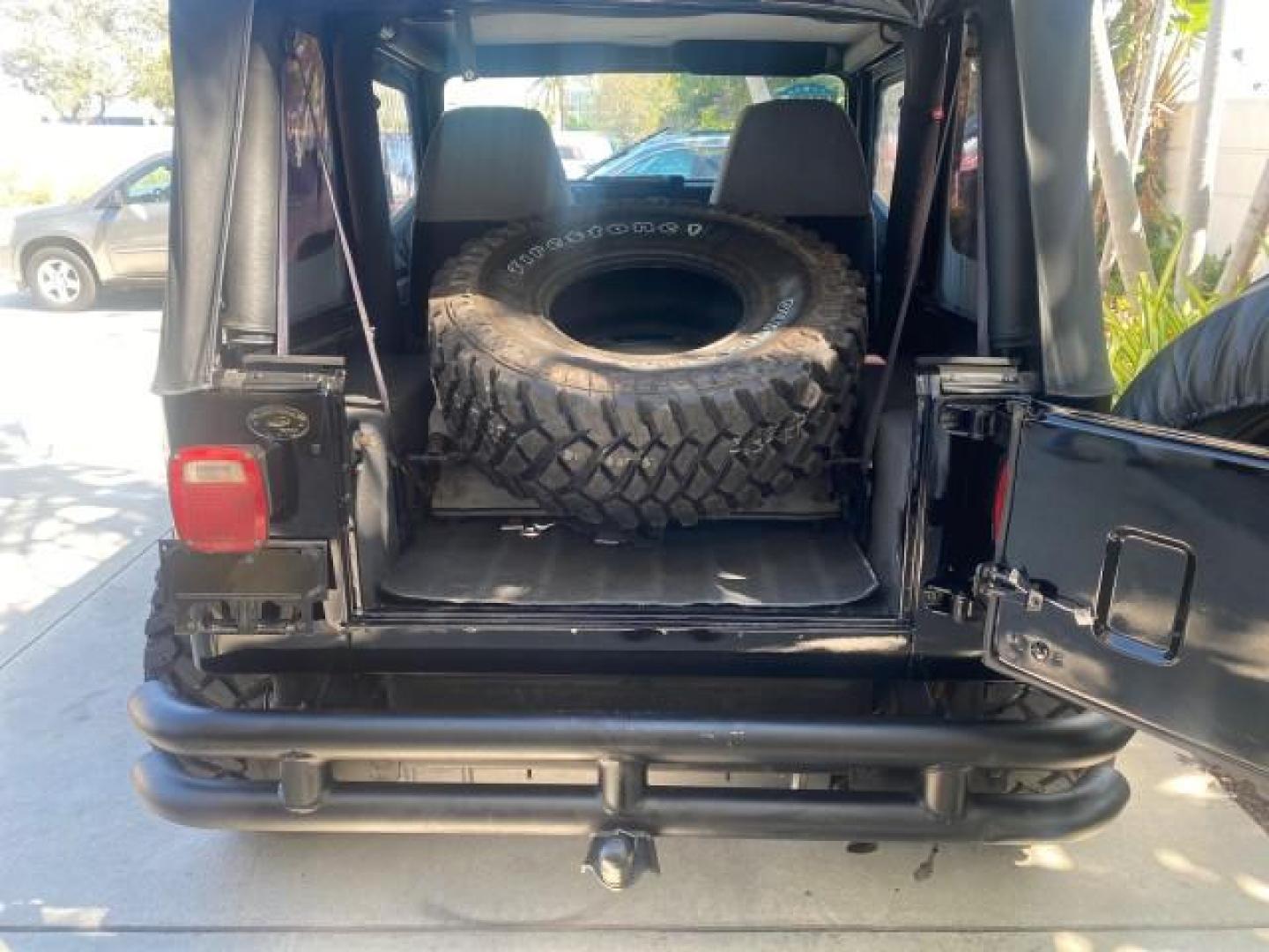 1994 Black /Gray Jeep Wrangler 4.0 6 CYL SE LOW MILES 87,813 (1J4FY29S8RP) with an 4.0L Straight 6-Cyl Engine engine, Automatic transmission, located at 4701 North Dixie Hwy, Pompano Beach, FL, 33064, (954) 422-2889, 26.240938, -80.123474 - OUR WEBPAGE FLORIDACARS1.COM HAS OVER 100 PHOTOS AND FREE CARFAX LINK 1994 JEEP WRANGLER SE AUTO AC BRAND NEW TOP WITH HARDWARE $ 2000 VALUE INCLUDED VIN: 1J4FY29S8RP433289 1 J 4 F Y 2 9 S 8 R P 4 3 3 2 8 9 UTILITY (BLAZER, JIMMY, SCOUT, ETC.) 4.0L I6 F GASOLINE REAR WHEEL DRIVE W/ 4X4 Features ABS - Photo#38