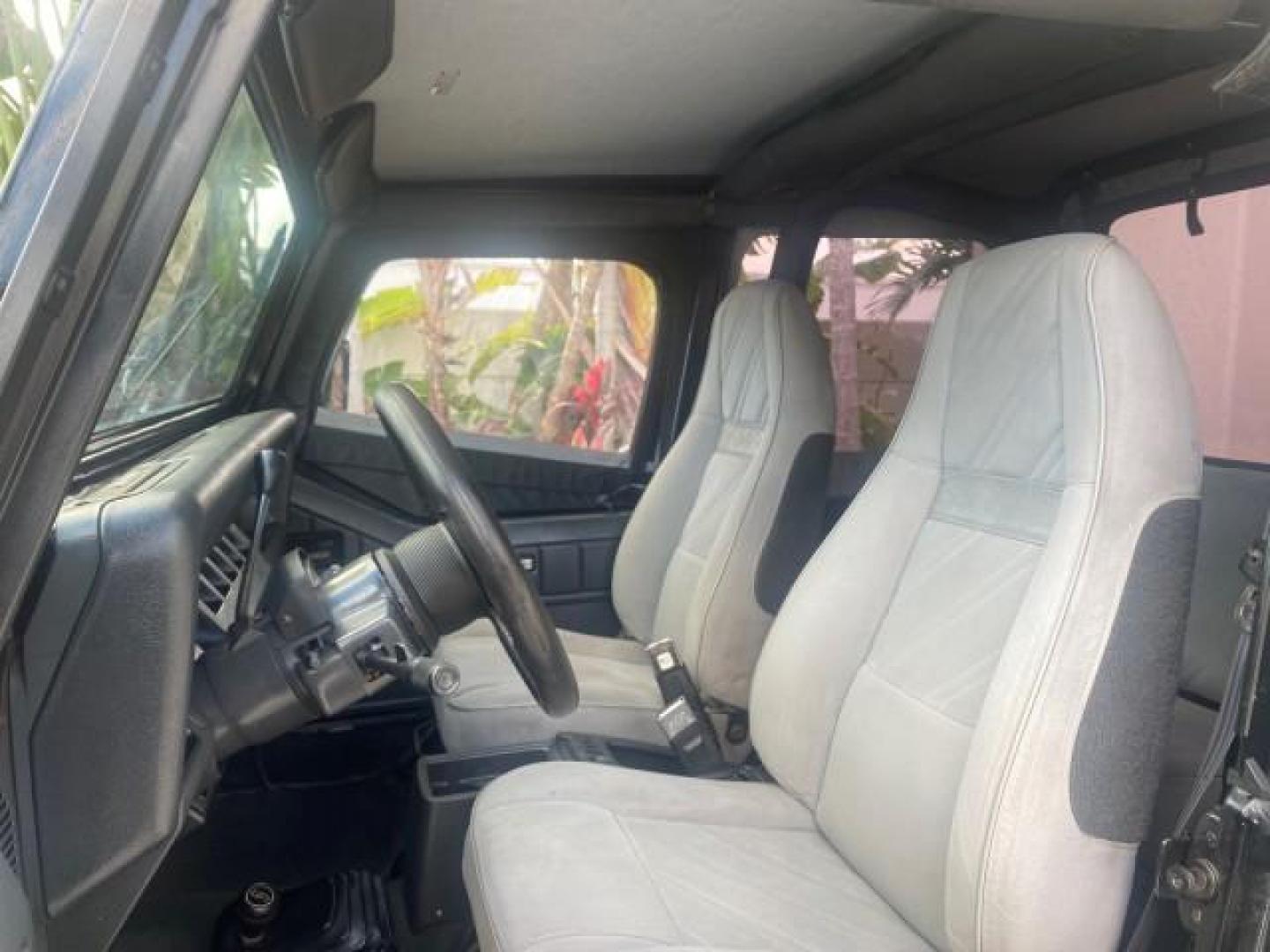 1994 Black /Gray Jeep Wrangler 4.0 6 CYL SE LOW MILES 87,813 (1J4FY29S8RP) with an 4.0L Straight 6-Cyl Engine engine, Automatic transmission, located at 4701 North Dixie Hwy, Pompano Beach, FL, 33064, (954) 422-2889, 26.240938, -80.123474 - OUR WEBPAGE FLORIDACARS1.COM HAS OVER 100 PHOTOS AND FREE CARFAX LINK 1994 JEEP WRANGLER SE AUTO AC BRAND NEW TOP WITH HARDWARE $ 2000 VALUE INCLUDED VIN: 1J4FY29S8RP433289 1 J 4 F Y 2 9 S 8 R P 4 3 3 2 8 9 UTILITY (BLAZER, JIMMY, SCOUT, ETC.) 4.0L I6 F GASOLINE REAR WHEEL DRIVE W/ 4X4 Features ABS - Photo#48