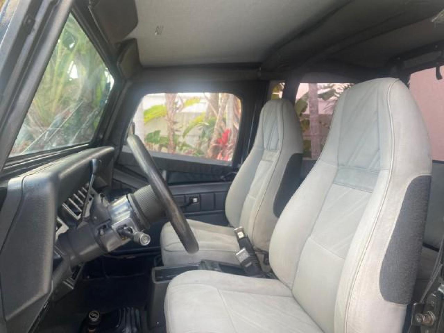 1994 Black /Gray Jeep Wrangler 4.0 6 CYL SE LOW MILES 87,813 (1J4FY29S8RP) with an 4.0L Straight 6-Cyl Engine engine, Automatic transmission, located at 4701 North Dixie Hwy, Pompano Beach, FL, 33064, (954) 422-2889, 26.240938, -80.123474 - OUR WEBPAGE FLORIDACARS1.COM HAS OVER 100 PHOTOS AND FREE CARFAX LINK 1994 JEEP WRANGLER SE AUTO AC BRAND NEW TOP WITH HARDWARE $ 2000 VALUE INCLUDED VIN: 1J4FY29S8RP433289 1 J 4 F Y 2 9 S 8 R P 4 3 3 2 8 9 UTILITY (BLAZER, JIMMY, SCOUT, ETC.) 4.0L I6 F GASOLINE REAR WHEEL DRIVE W/ 4X4 Features ABS - Photo#49