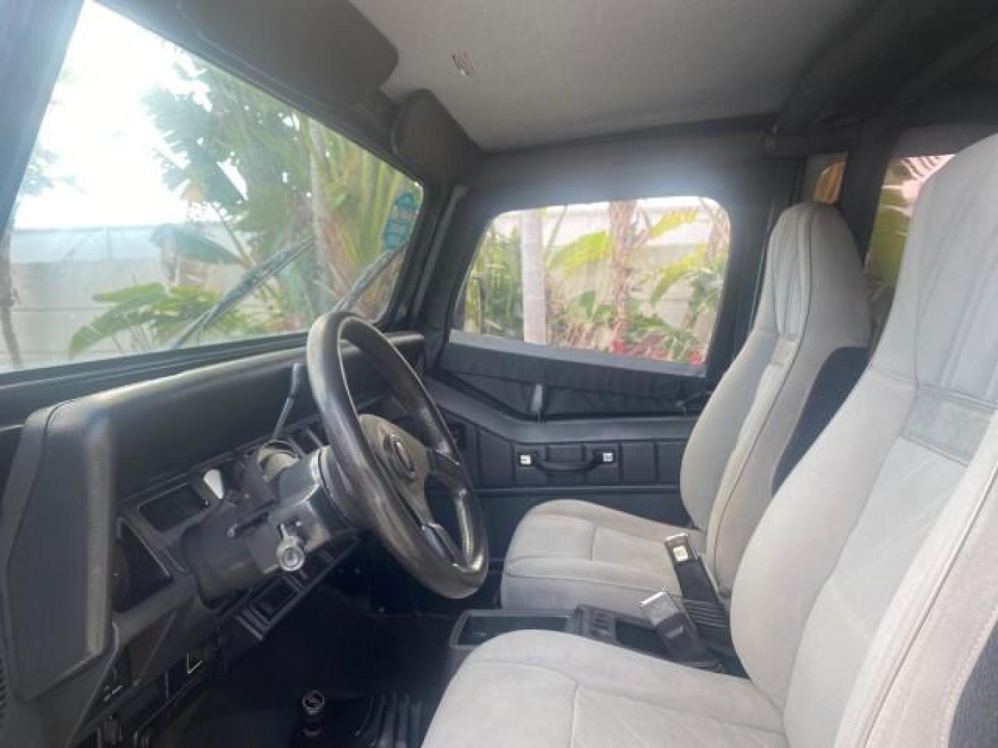 1994 Black /Gray Jeep Wrangler 4.0 6 CYL SE LOW MILES 87,813 (1J4FY29S8RP) with an 4.0L Straight 6-Cyl Engine engine, Automatic transmission, located at 4701 North Dixie Hwy, Pompano Beach, FL, 33064, (954) 422-2889, 26.240938, -80.123474 - OUR WEBPAGE FLORIDACARS1.COM HAS OVER 100 PHOTOS AND FREE CARFAX LINK 1994 JEEP WRANGLER SE AUTO AC BRAND NEW TOP WITH HARDWARE $ 2000 VALUE INCLUDED VIN: 1J4FY29S8RP433289 1 J 4 F Y 2 9 S 8 R P 4 3 3 2 8 9 UTILITY (BLAZER, JIMMY, SCOUT, ETC.) 4.0L I6 F GASOLINE REAR WHEEL DRIVE W/ 4X4 Features ABS - Photo#50