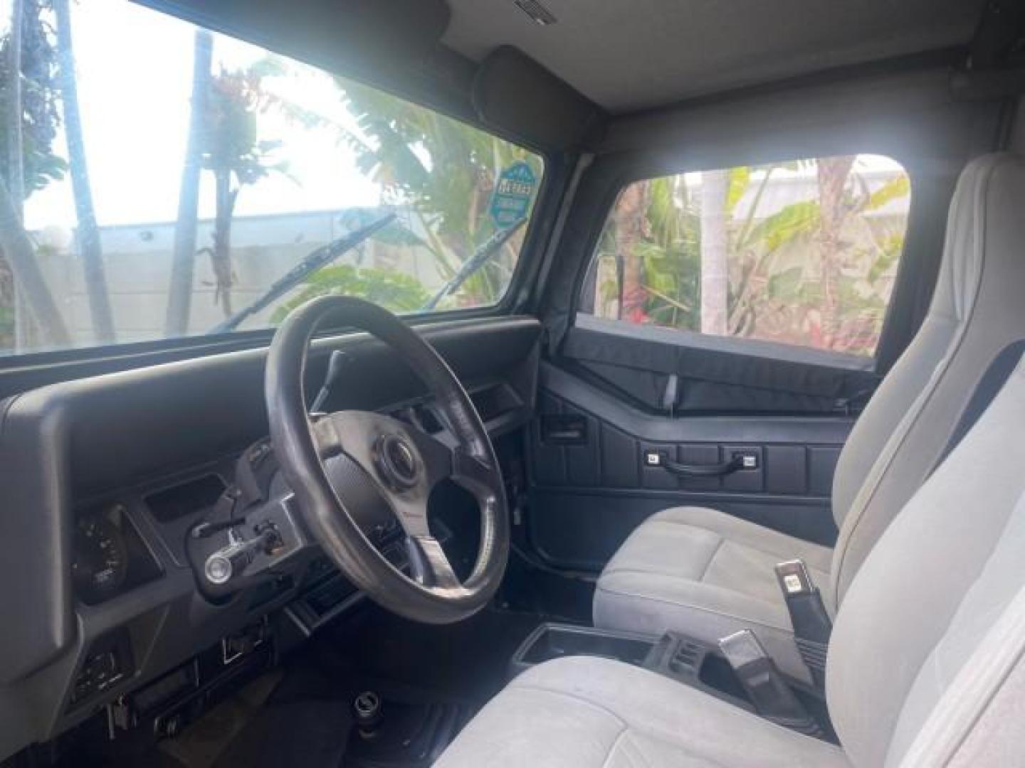 1994 Black /Gray Jeep Wrangler 4.0 6 CYL SE LOW MILES 87,813 (1J4FY29S8RP) with an 4.0L Straight 6-Cyl Engine engine, Automatic transmission, located at 4701 North Dixie Hwy, Pompano Beach, FL, 33064, (954) 422-2889, 26.240938, -80.123474 - OUR WEBPAGE FLORIDACARS1.COM HAS OVER 100 PHOTOS AND FREE CARFAX LINK 1994 JEEP WRANGLER SE AUTO AC BRAND NEW TOP WITH HARDWARE $ 2000 VALUE INCLUDED VIN: 1J4FY29S8RP433289 1 J 4 F Y 2 9 S 8 R P 4 3 3 2 8 9 UTILITY (BLAZER, JIMMY, SCOUT, ETC.) 4.0L I6 F GASOLINE REAR WHEEL DRIVE W/ 4X4 Features ABS - Photo#51