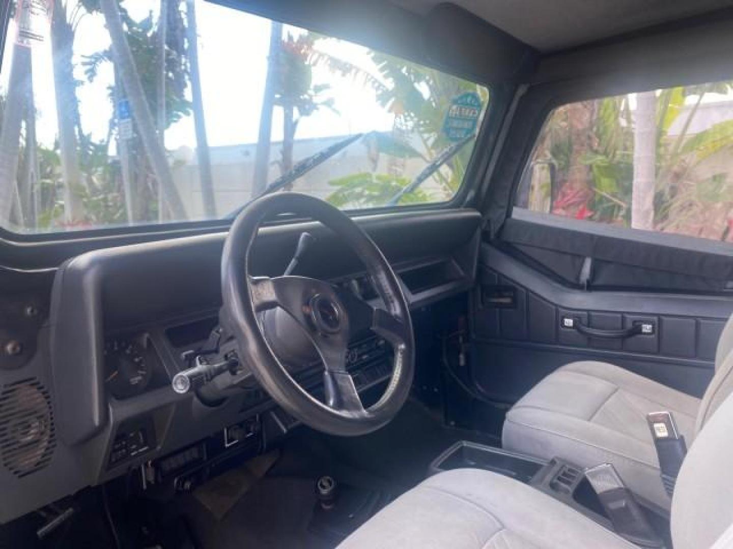 1994 Black /Gray Jeep Wrangler 4.0 6 CYL SE LOW MILES 87,813 (1J4FY29S8RP) with an 4.0L Straight 6-Cyl Engine engine, Automatic transmission, located at 4701 North Dixie Hwy, Pompano Beach, FL, 33064, (954) 422-2889, 26.240938, -80.123474 - OUR WEBPAGE FLORIDACARS1.COM HAS OVER 100 PHOTOS AND FREE CARFAX LINK 1994 JEEP WRANGLER SE AUTO AC BRAND NEW TOP WITH HARDWARE $ 2000 VALUE INCLUDED VIN: 1J4FY29S8RP433289 1 J 4 F Y 2 9 S 8 R P 4 3 3 2 8 9 UTILITY (BLAZER, JIMMY, SCOUT, ETC.) 4.0L I6 F GASOLINE REAR WHEEL DRIVE W/ 4X4 Features ABS - Photo#52