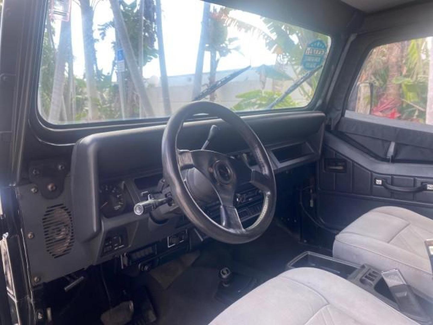 1994 Black /Gray Jeep Wrangler 4.0 6 CYL SE LOW MILES 87,813 (1J4FY29S8RP) with an 4.0L Straight 6-Cyl Engine engine, Automatic transmission, located at 4701 North Dixie Hwy, Pompano Beach, FL, 33064, (954) 422-2889, 26.240938, -80.123474 - OUR WEBPAGE FLORIDACARS1.COM HAS OVER 100 PHOTOS AND FREE CARFAX LINK 1994 JEEP WRANGLER SE AUTO AC BRAND NEW TOP WITH HARDWARE $ 2000 VALUE INCLUDED VIN: 1J4FY29S8RP433289 1 J 4 F Y 2 9 S 8 R P 4 3 3 2 8 9 UTILITY (BLAZER, JIMMY, SCOUT, ETC.) 4.0L I6 F GASOLINE REAR WHEEL DRIVE W/ 4X4 Features ABS - Photo#53