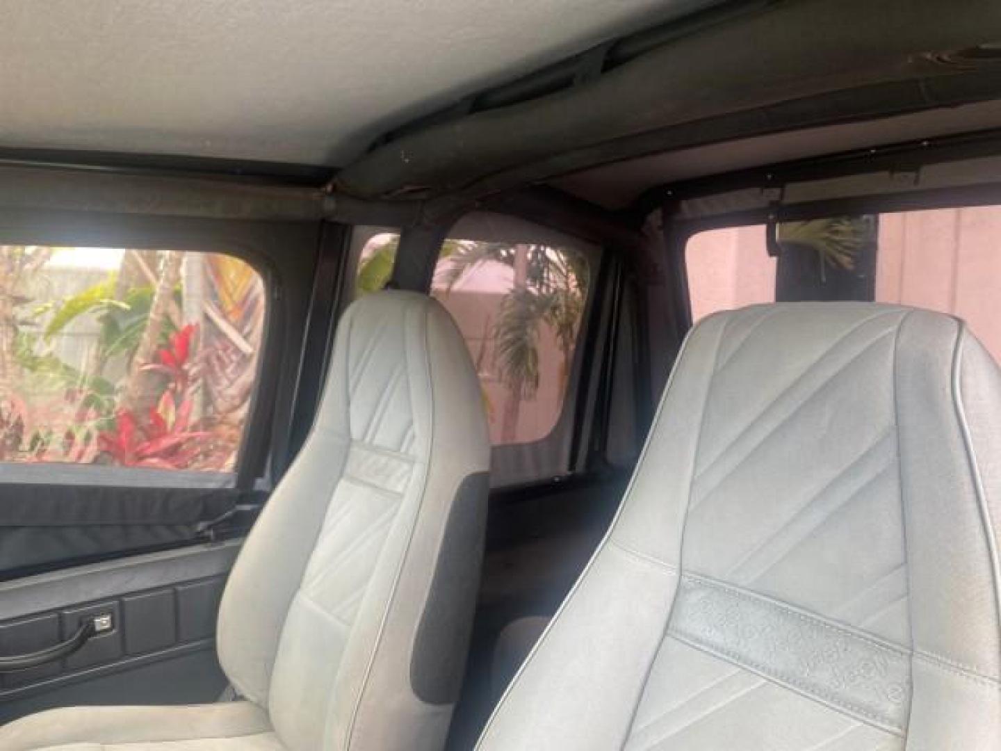 1994 Black /Gray Jeep Wrangler 4.0 6 CYL SE LOW MILES 87,813 (1J4FY29S8RP) with an 4.0L Straight 6-Cyl Engine engine, Automatic transmission, located at 4701 North Dixie Hwy, Pompano Beach, FL, 33064, (954) 422-2889, 26.240938, -80.123474 - OUR WEBPAGE FLORIDACARS1.COM HAS OVER 100 PHOTOS AND FREE CARFAX LINK 1994 JEEP WRANGLER SE AUTO AC BRAND NEW TOP WITH HARDWARE $ 2000 VALUE INCLUDED VIN: 1J4FY29S8RP433289 1 J 4 F Y 2 9 S 8 R P 4 3 3 2 8 9 UTILITY (BLAZER, JIMMY, SCOUT, ETC.) 4.0L I6 F GASOLINE REAR WHEEL DRIVE W/ 4X4 Features ABS - Photo#72