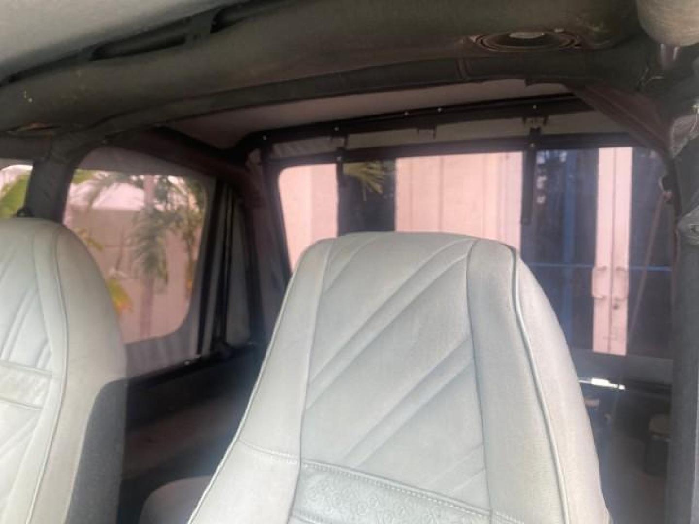 1994 Black /Gray Jeep Wrangler 4.0 6 CYL SE LOW MILES 87,813 (1J4FY29S8RP) with an 4.0L Straight 6-Cyl Engine engine, Automatic transmission, located at 4701 North Dixie Hwy, Pompano Beach, FL, 33064, (954) 422-2889, 26.240938, -80.123474 - OUR WEBPAGE FLORIDACARS1.COM HAS OVER 100 PHOTOS AND FREE CARFAX LINK 1994 JEEP WRANGLER SE AUTO AC BRAND NEW TOP WITH HARDWARE $ 2000 VALUE INCLUDED VIN: 1J4FY29S8RP433289 1 J 4 F Y 2 9 S 8 R P 4 3 3 2 8 9 UTILITY (BLAZER, JIMMY, SCOUT, ETC.) 4.0L I6 F GASOLINE REAR WHEEL DRIVE W/ 4X4 Features ABS - Photo#73